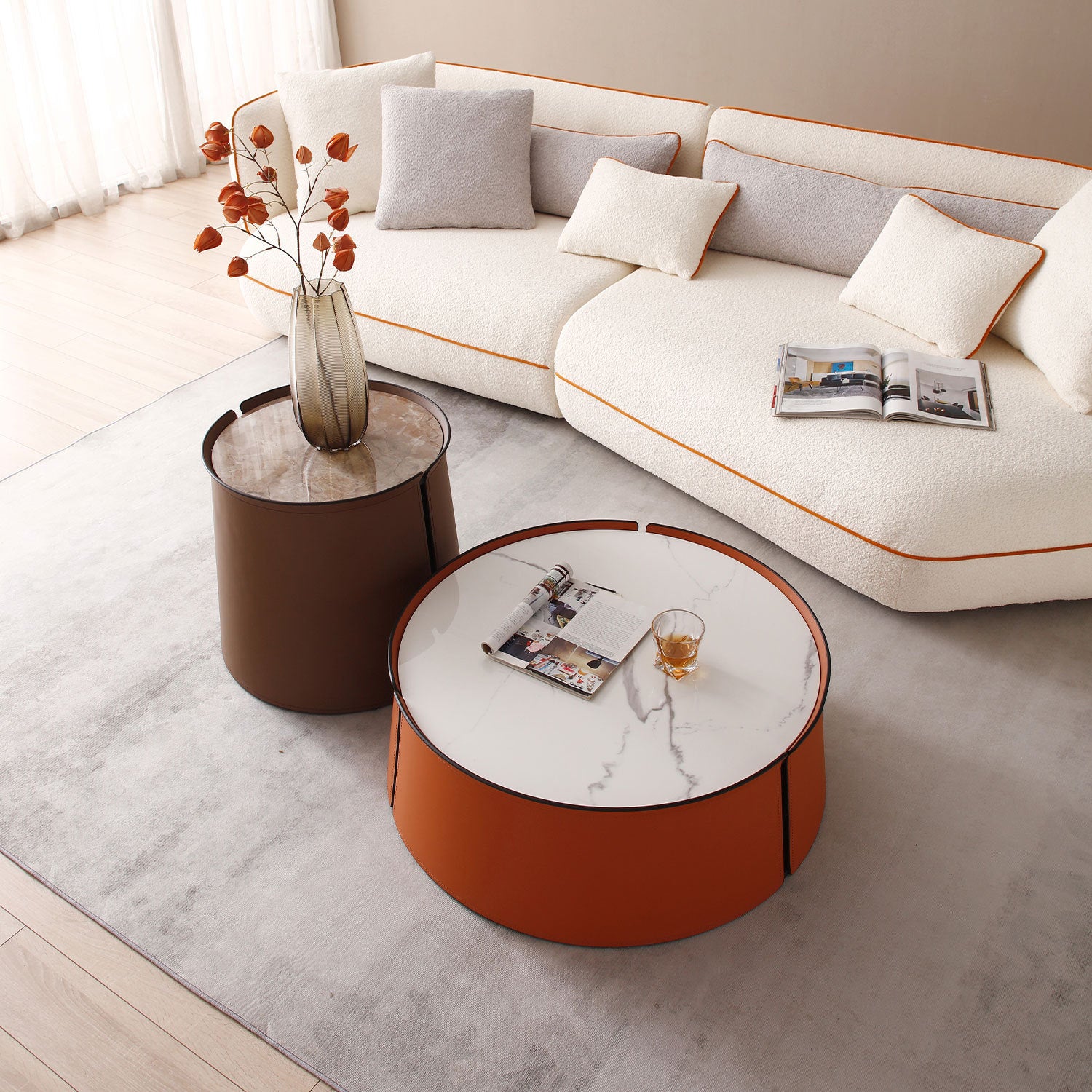 A stylish 31.5-inch coffee table featuring a luxurious marble top, vibrant orange saddle leather body, and a sturdy iron frame, perfect for modern living spaces.