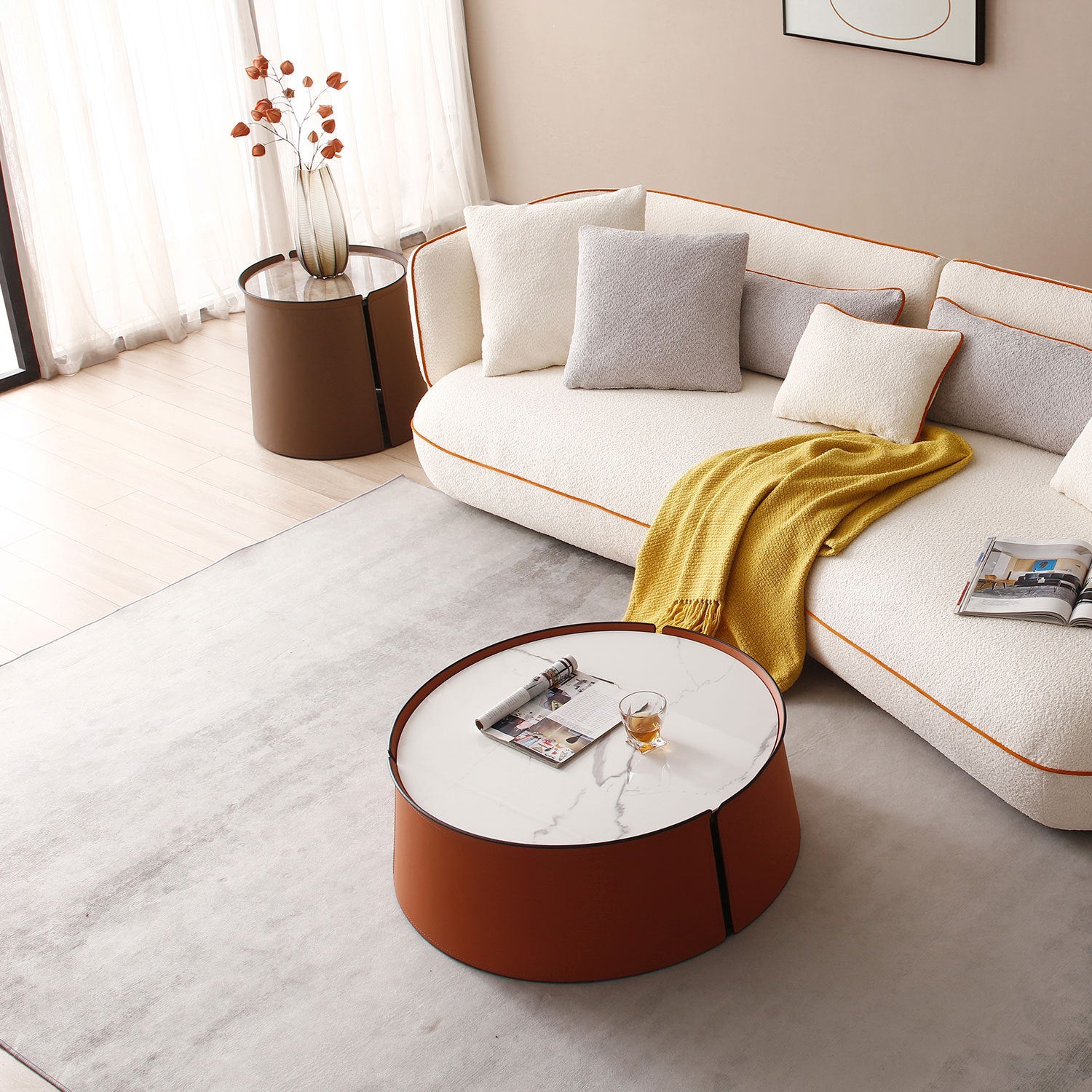 A stylish 31.5-inch coffee table featuring a luxurious marble top, vibrant orange saddle leather body, and a sturdy iron frame, perfect for modern living spaces.