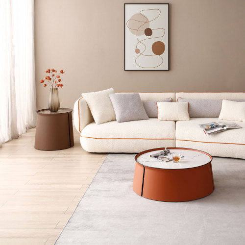 A stylish 31.5-inch coffee table featuring a luxurious marble top, orange saddle leather body, and a sturdy iron frame, perfect for modern living spaces.