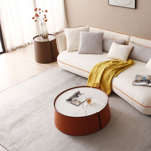 A stylish 31.5-inch coffee table featuring a luxurious marble top, orange saddle leather body, and a sturdy iron frame, perfect for modern living spaces.