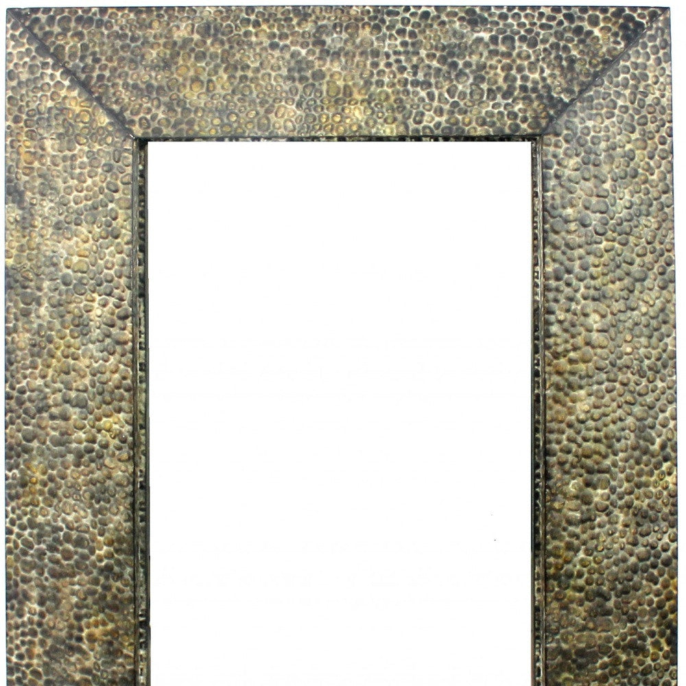 A rectangular dressing mirror with a bronze gravel-like mosaic frame, showcasing a coastal style perfect for home decor.
