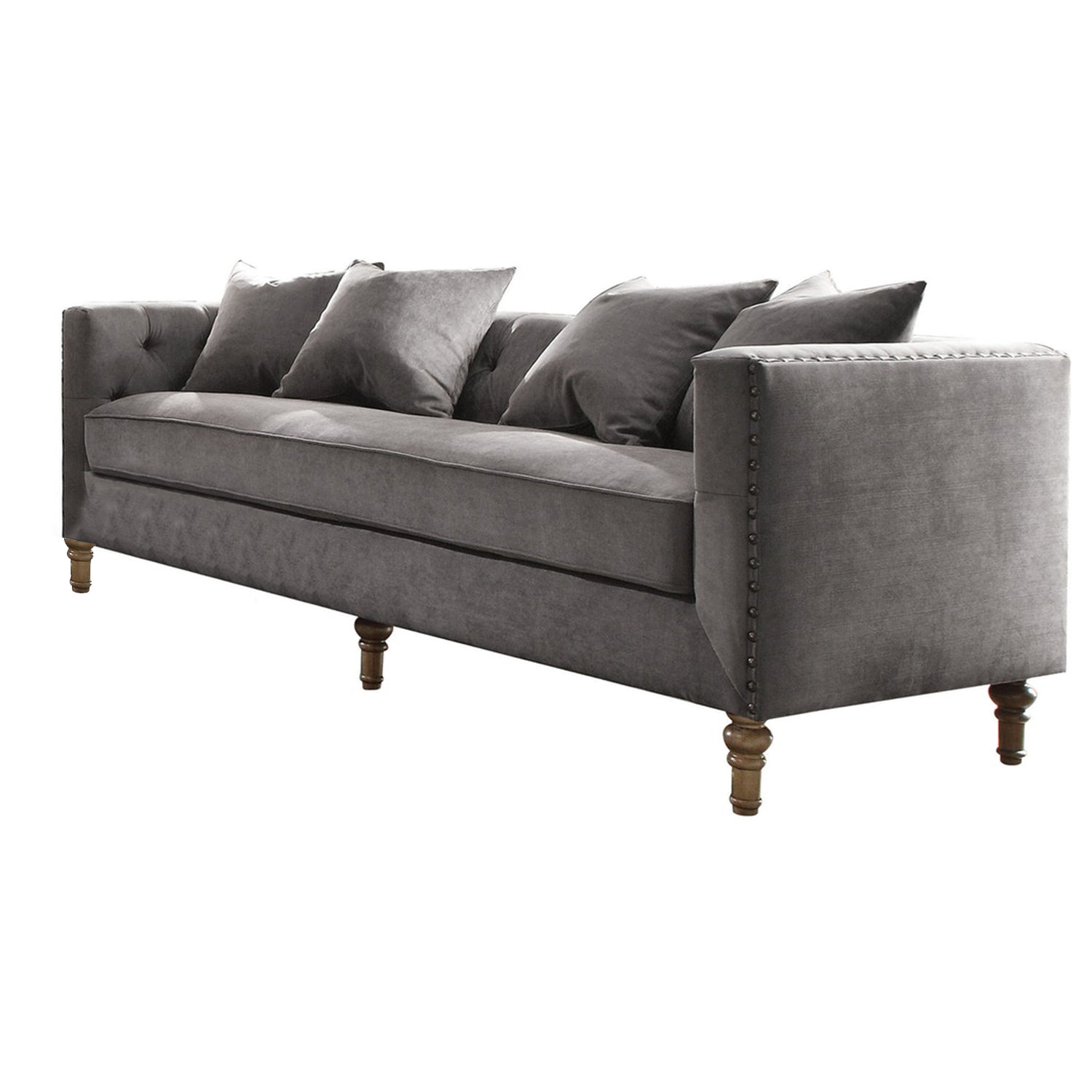 Gray velvet upholstery sofa with tufted back and 4 pillows, showcasing mid-century modern design and elegant nailhead trim.
