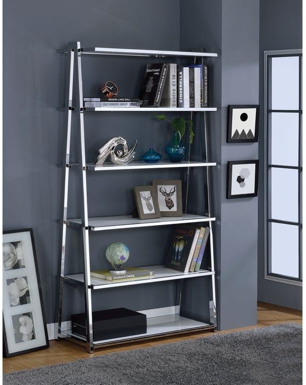 A modern white high gloss and chrome bookcase featuring six fixed wooden shelves, elegantly displayed in a living room setting.