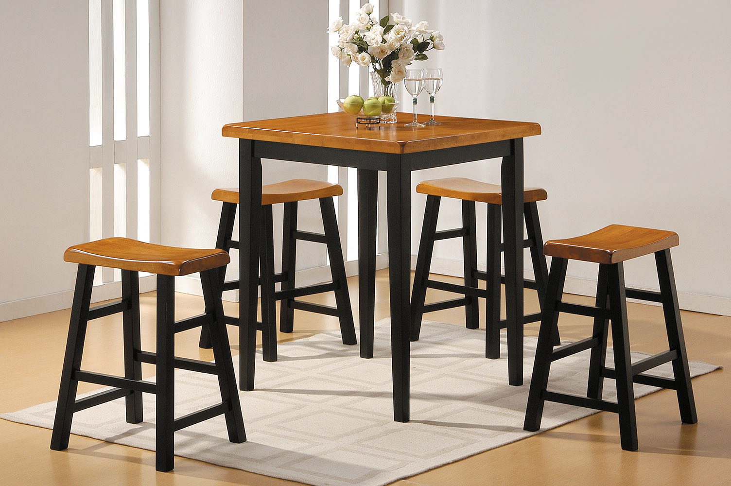 5-piece Oak Black Rubber Wood Counter set featuring a table and four backless stools, designed for space-saving and comfort.