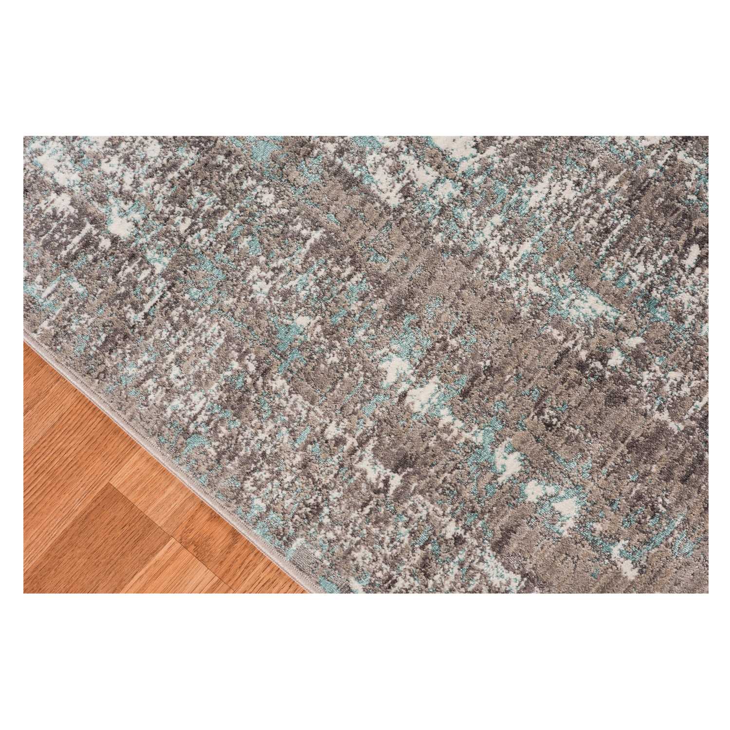 Gray polyester area rug measuring 3.93 inches by 5.57 inches, showcasing a transitional design suitable for modern home decor.