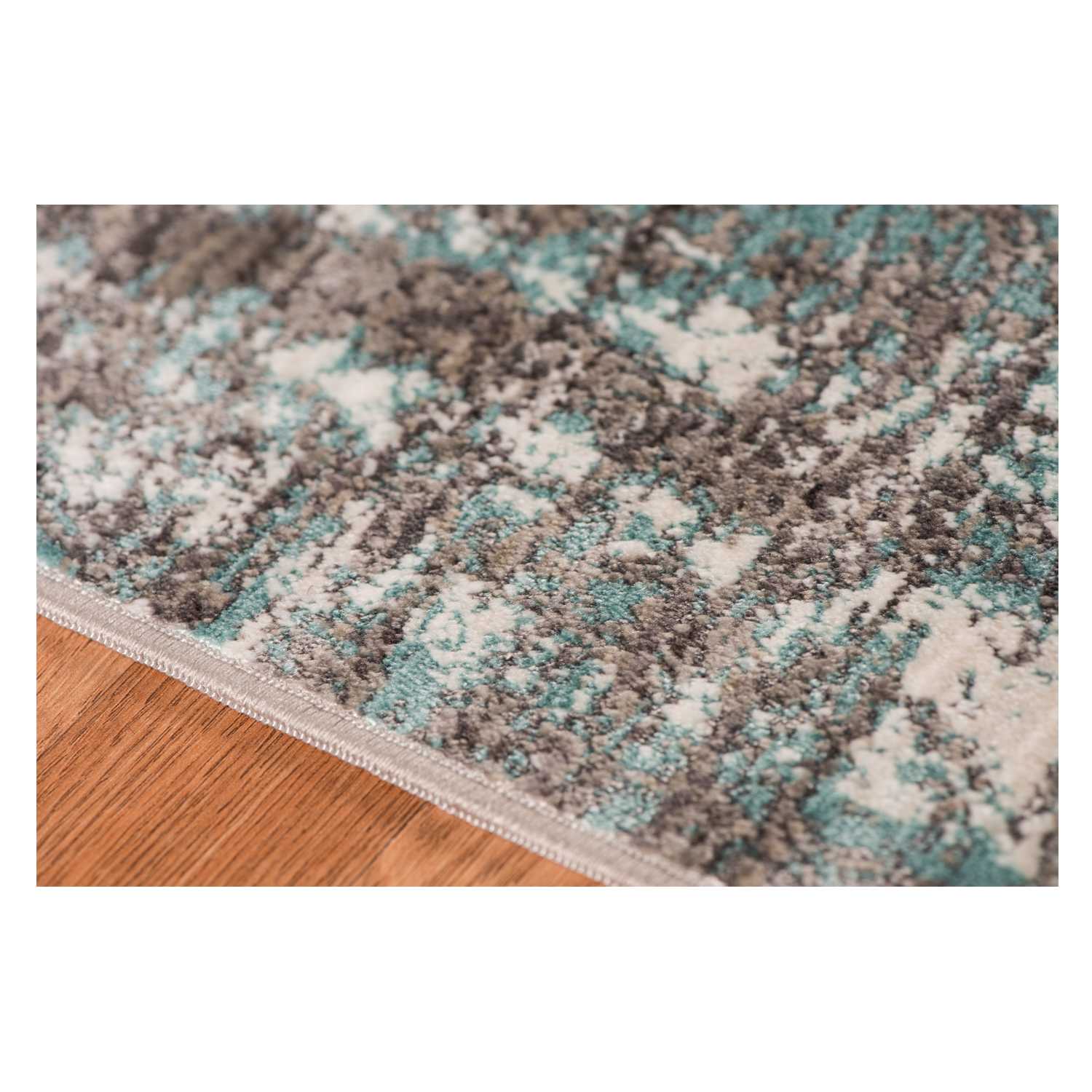 Gray polyester area rug measuring 3.93 inches by 5.57 inches, showcasing a transitional design suitable for modern home decor.