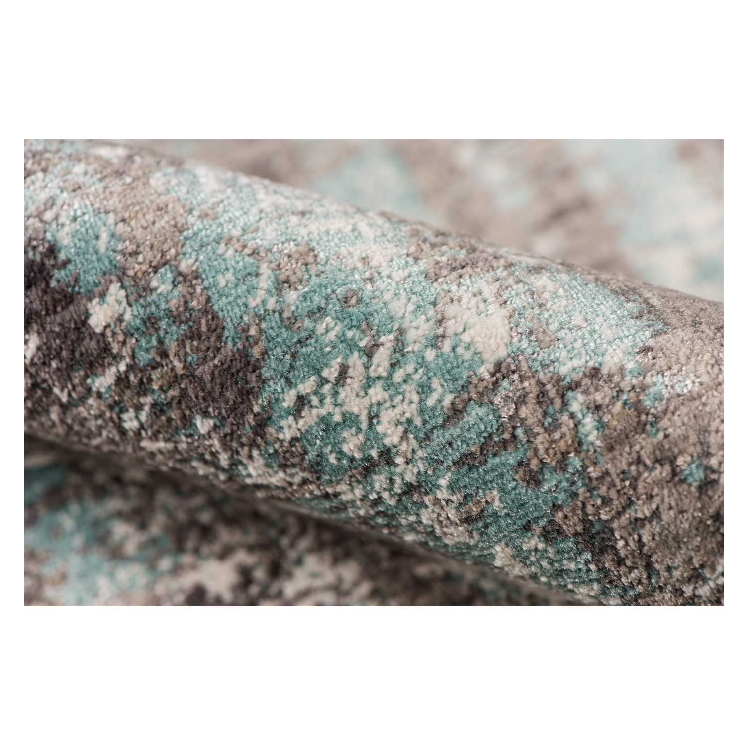 Gray polyester area rug measuring 3.93 inches by 5.57 inches, showcasing a transitional design suitable for modern home decor.