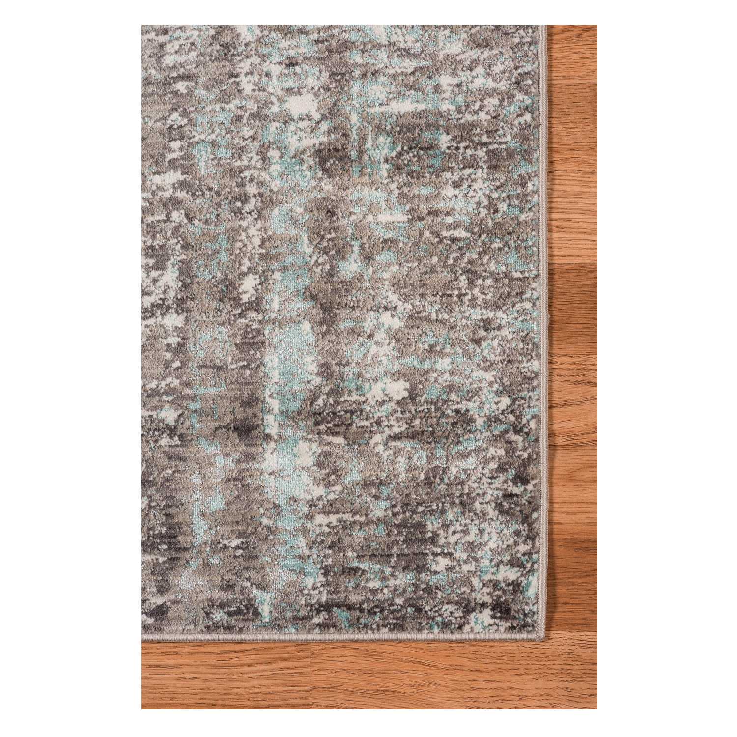 Gray polyester area rug measuring 3.93 inches by 5.57 inches, showcasing a transitional design suitable for modern home decor.