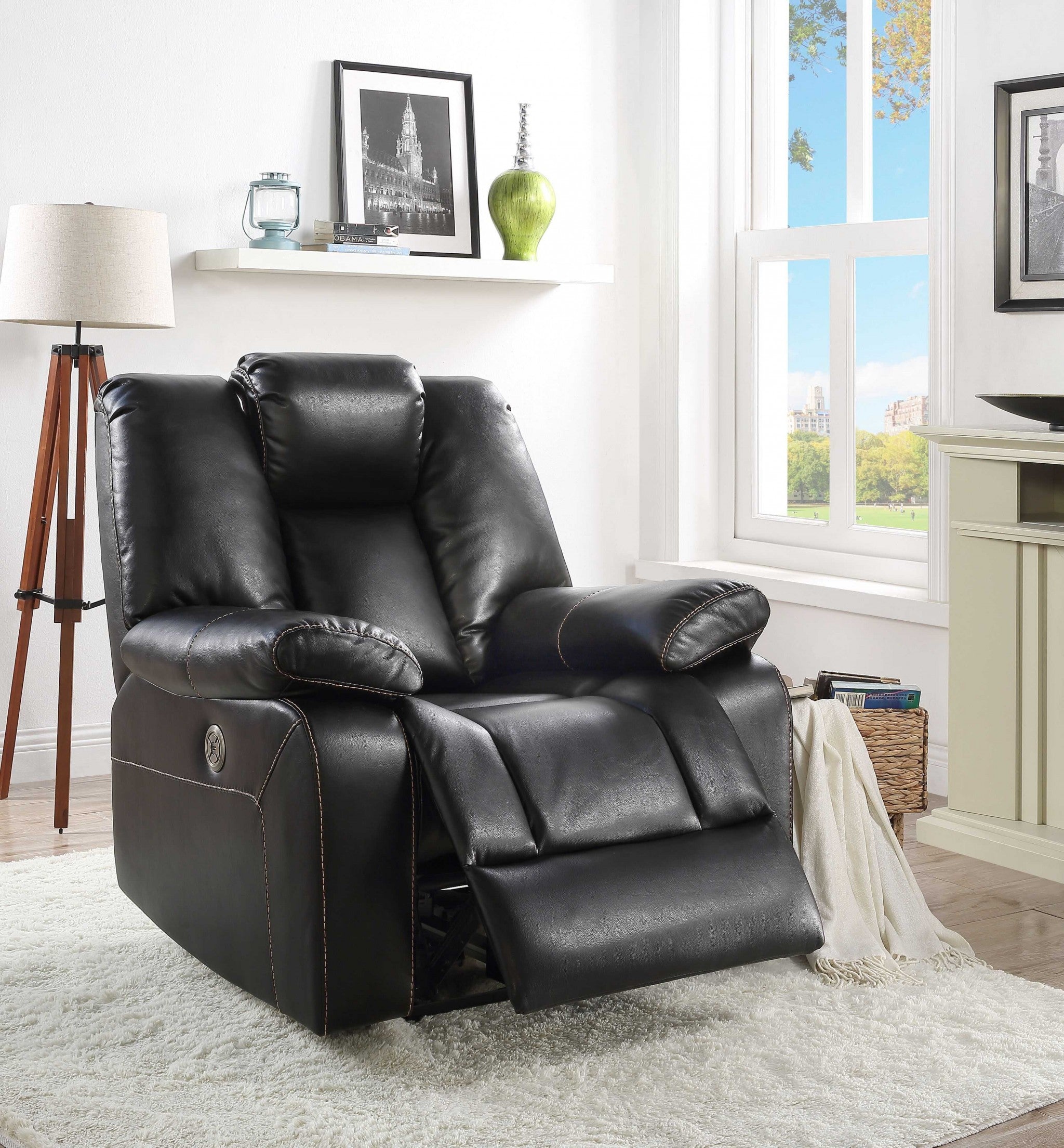 39x39x43 inches black leather-aire upholstery recliner with plush seat and sloped armrests, perfect for contemporary living rooms.