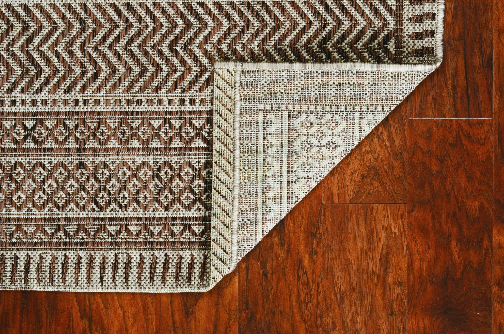 3 inches x 4 inches Mocha Polypropylene Area Rug showcasing a contemporary design suitable for indoor and outdoor use.