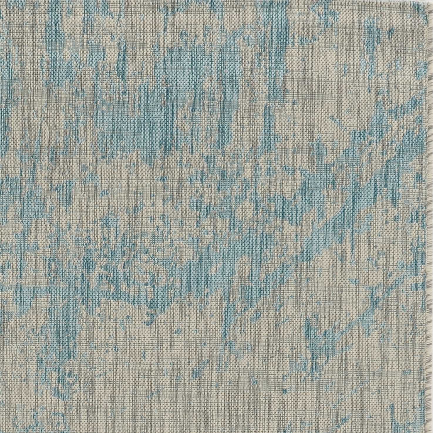 A vibrant teal polypropylene area rug measuring 3x4 inches, showcasing a contemporary design suitable for indoor and outdoor use.