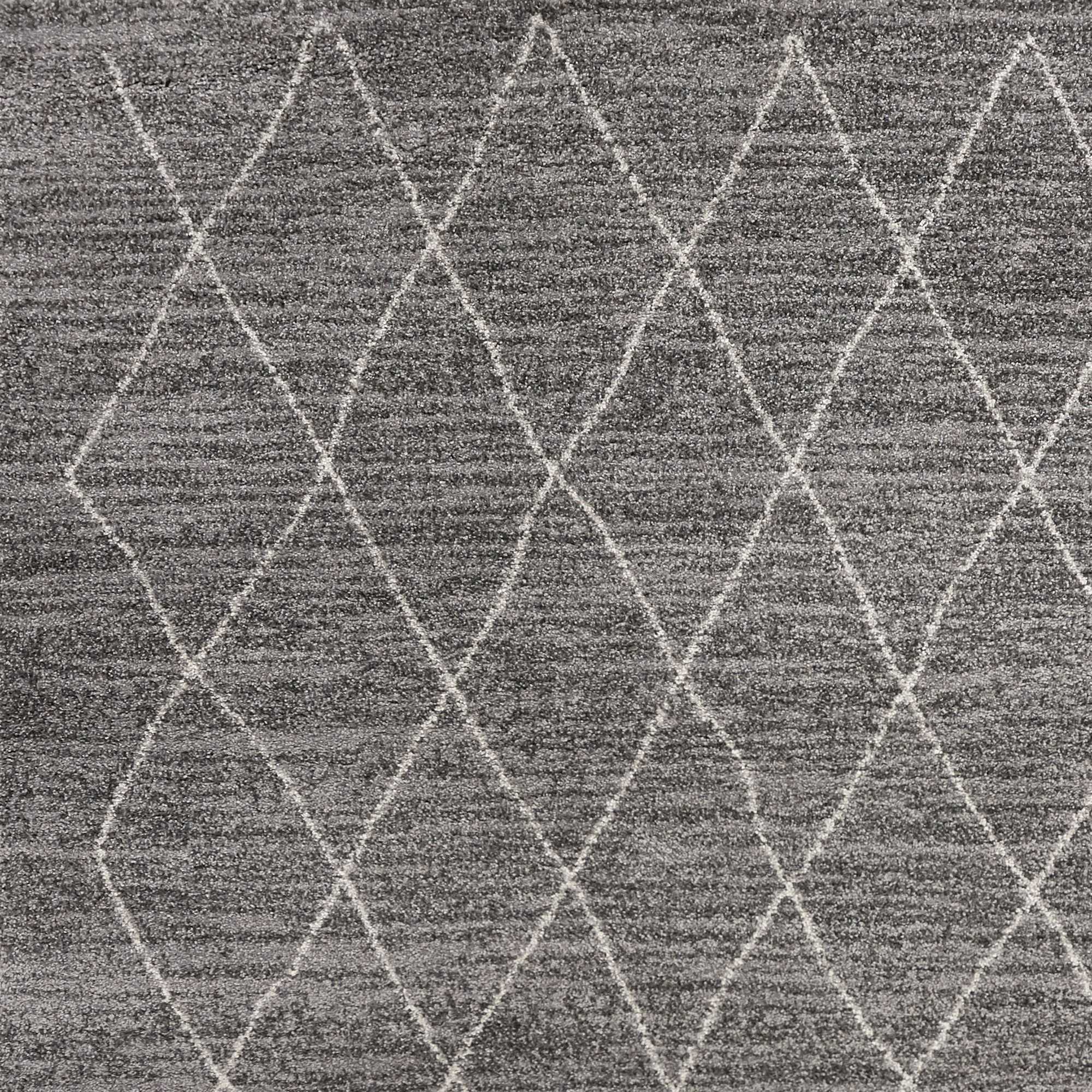 A plush grey area rug featuring a diamond pattern, perfect for modern home decor.