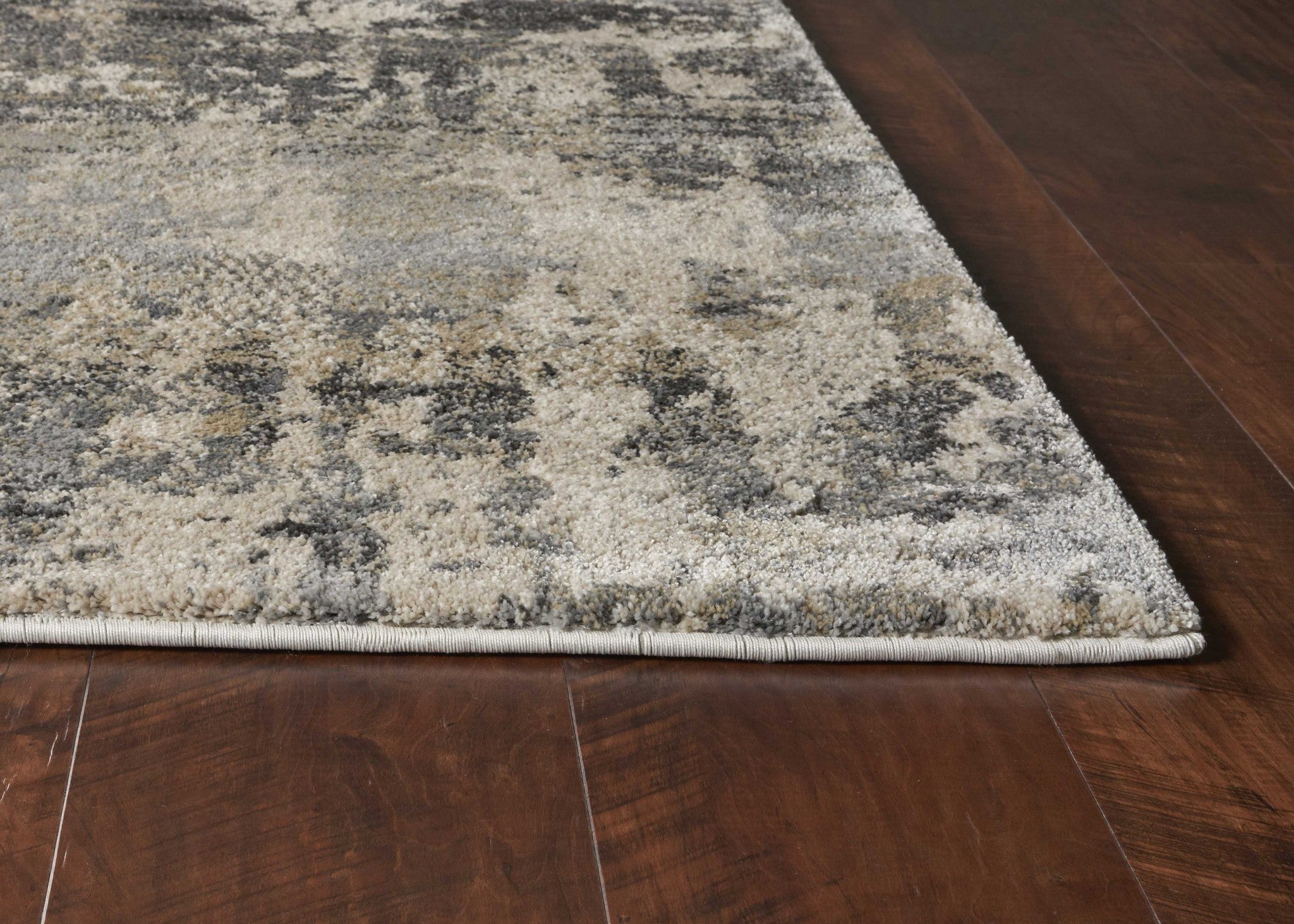 A beautiful 3x5 inches natural abstract area rug featuring a beige color palette, showcasing its intricate design and high-quality polypropylene material.