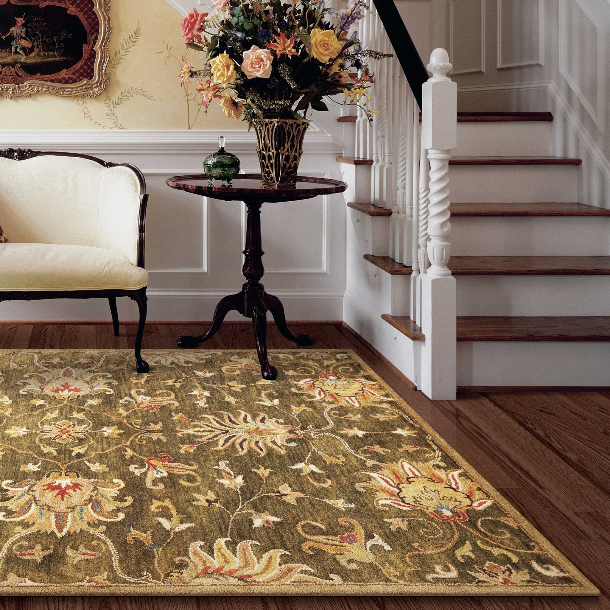 Emerald green hand-tufted wool rug featuring a traditional floral design, perfect for enhancing indoor decor.