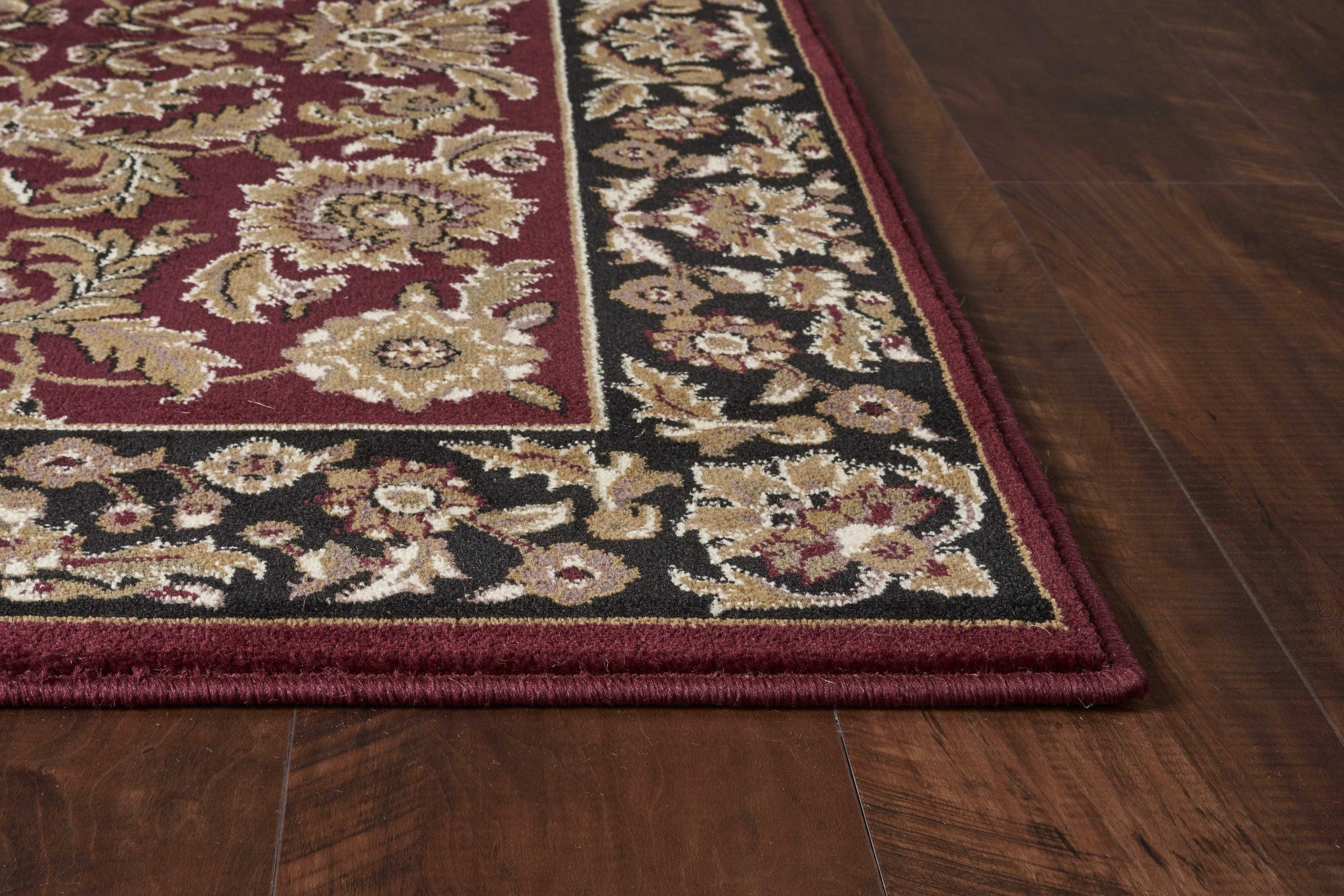 A beautiful 3x5 inches red and black floral traditional indoor rug, showcasing intricate patterns and a vibrant color palette, perfect for enhancing home decor.