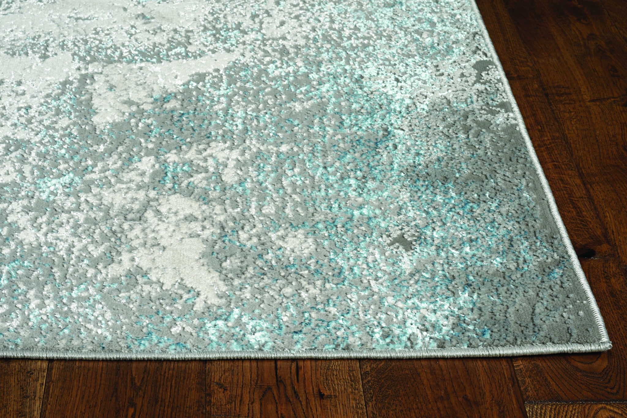 3x5 inches silver blue machine woven abstract smudge indoor area rug showcasing intricate design and soft texture.