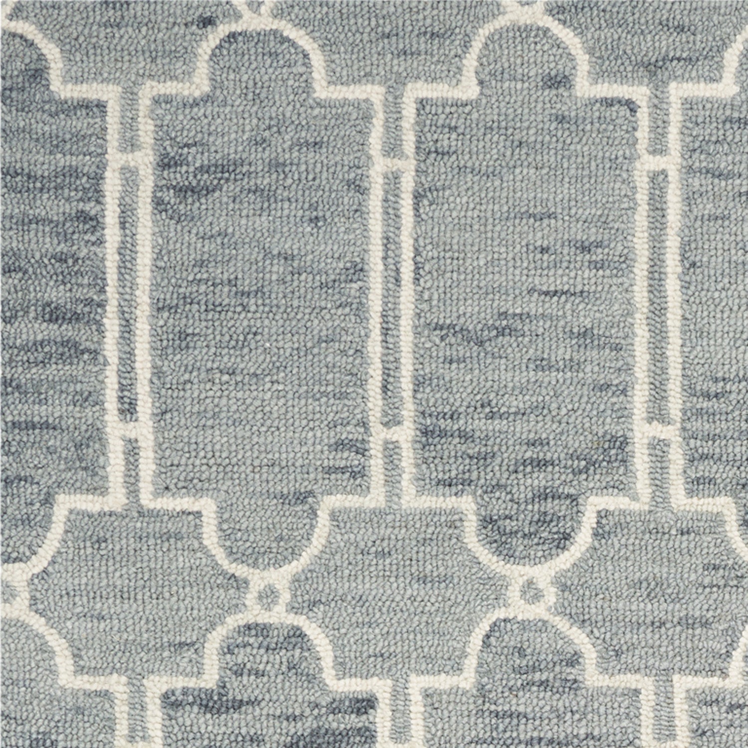 A beautiful slate blue hand-tufted geometric indoor area rug, showcasing modern patterns and a soft wool texture, perfect for enhancing home decor.