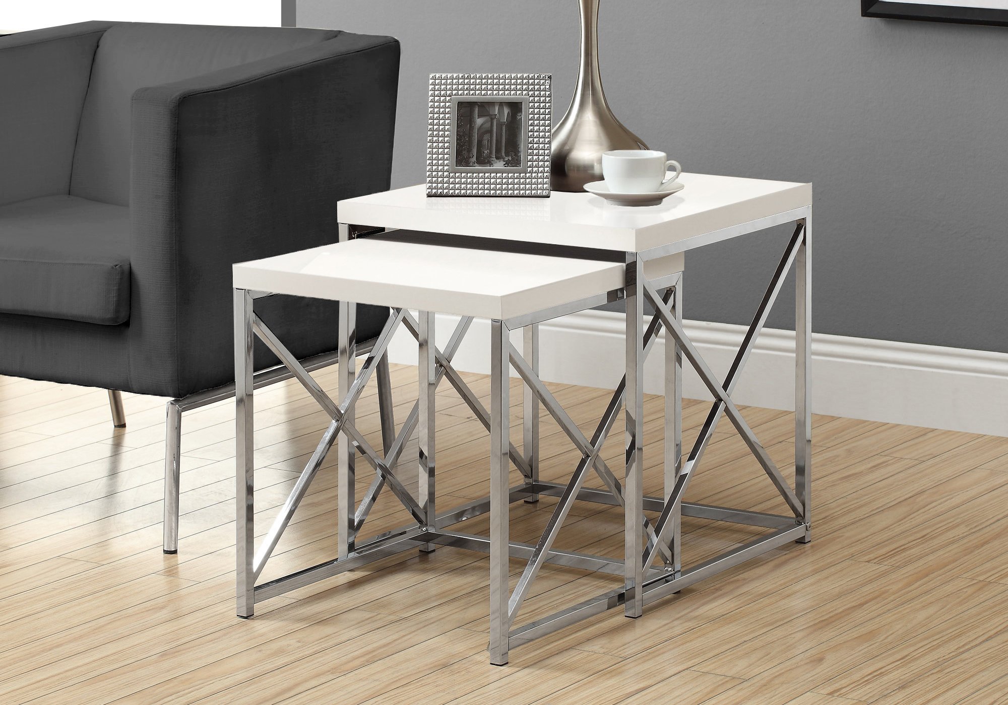 A stylish 40.5" nesting table set featuring a particle board top and chrome metal legs, elegantly designed for modern home decor.