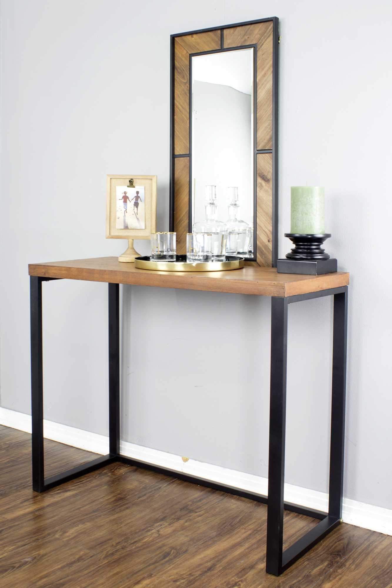 Stylish 41.25" X 16" X 30" console table made of natural metal, wood, and MDF, featuring a sophisticated design and ample storage space.