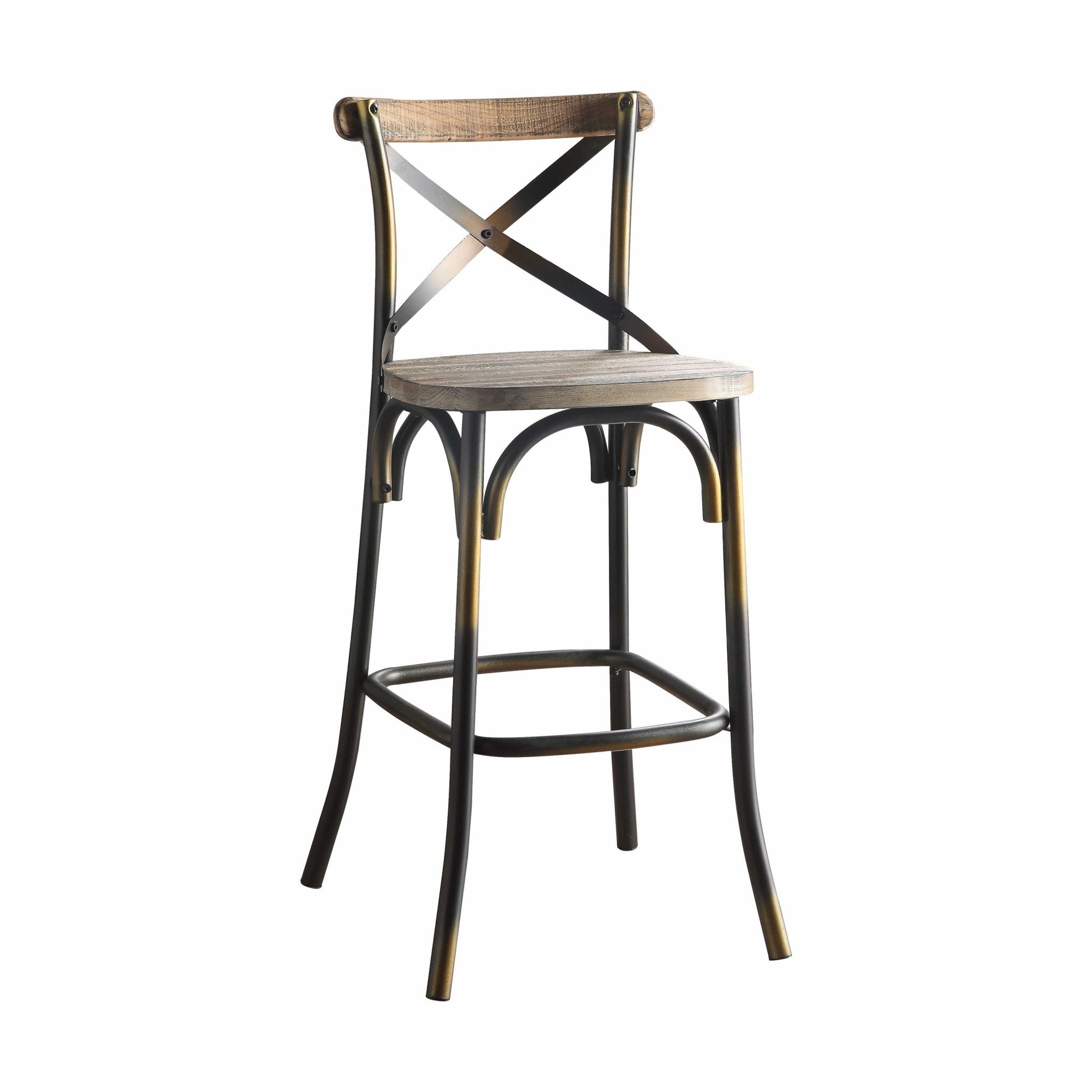 A vintage style bar chair featuring an antiqued copper and oak finish, with a simple 'X' style backrest and a wooden seat.