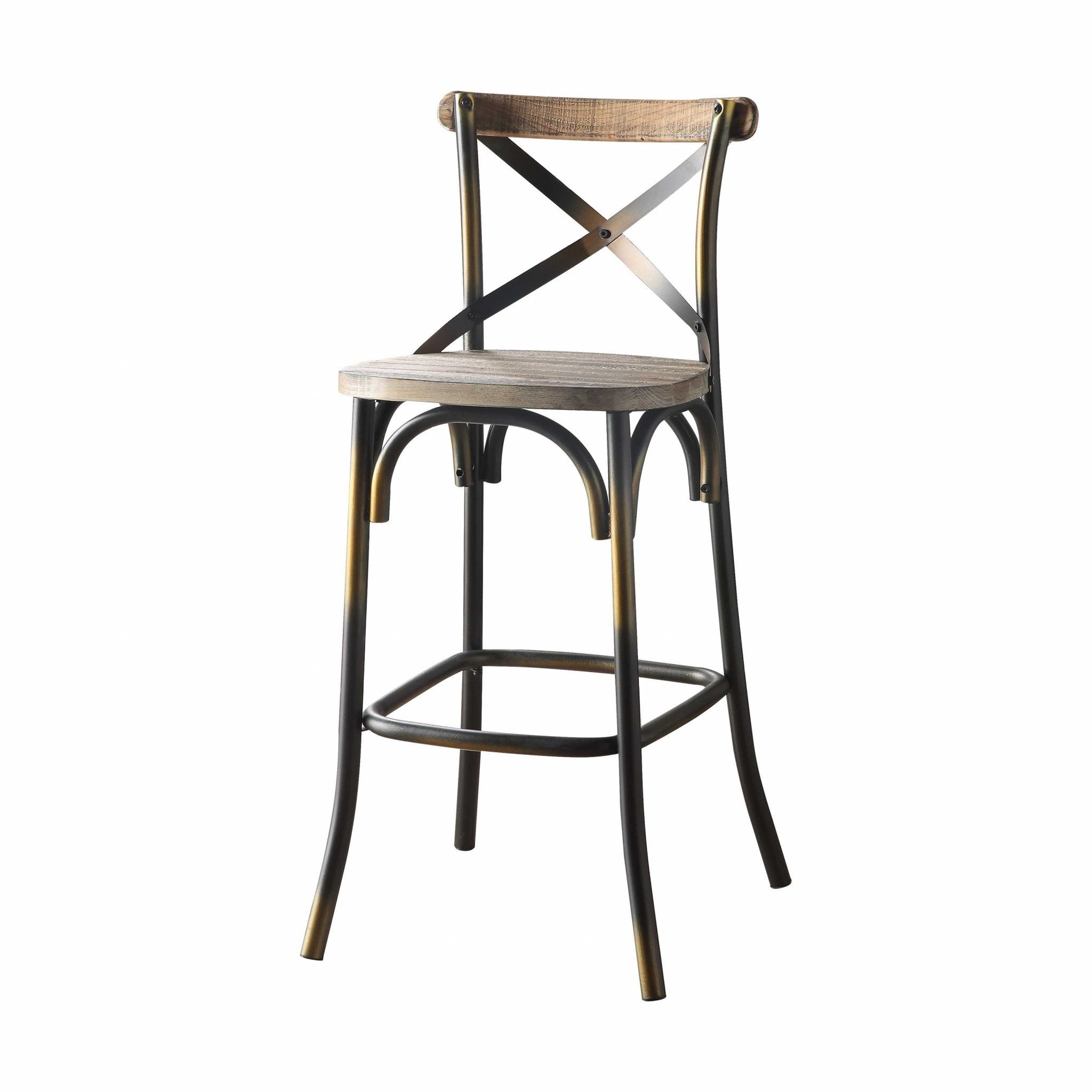 A vintage style bar chair featuring an antiqued copper and oak finish, with a simple 'X' style backrest and a wooden seat.
