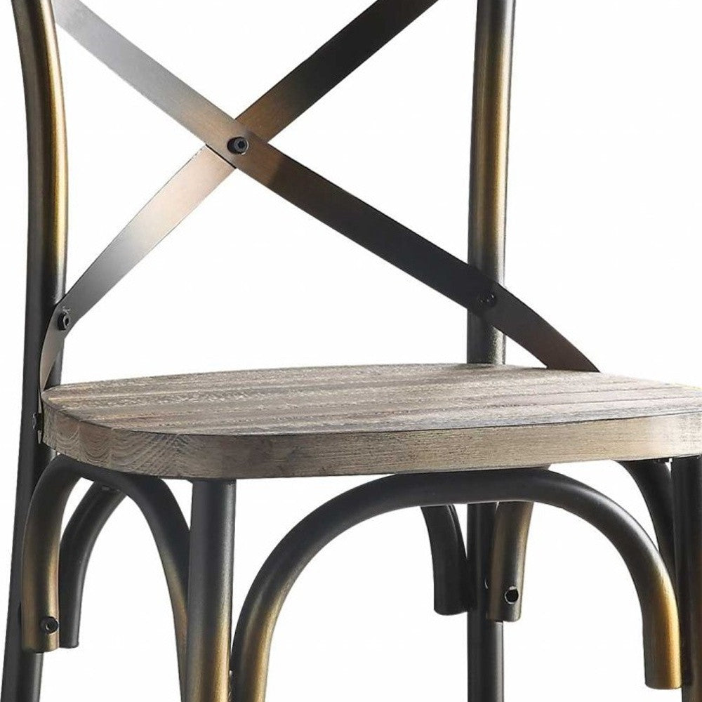 A vintage style bar chair featuring an antiqued copper and oak finish, with a simple 'X' style backrest and a wooden seat.