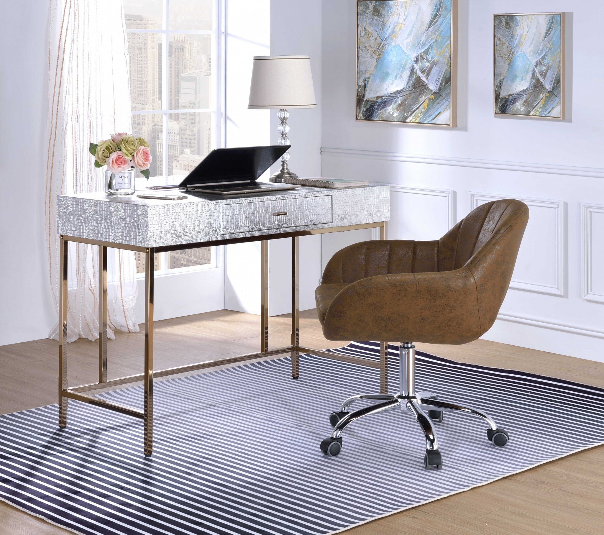A stylish champagne and silver metal tube desk featuring a rectangular top and a middle drawer, perfect for home office use.
