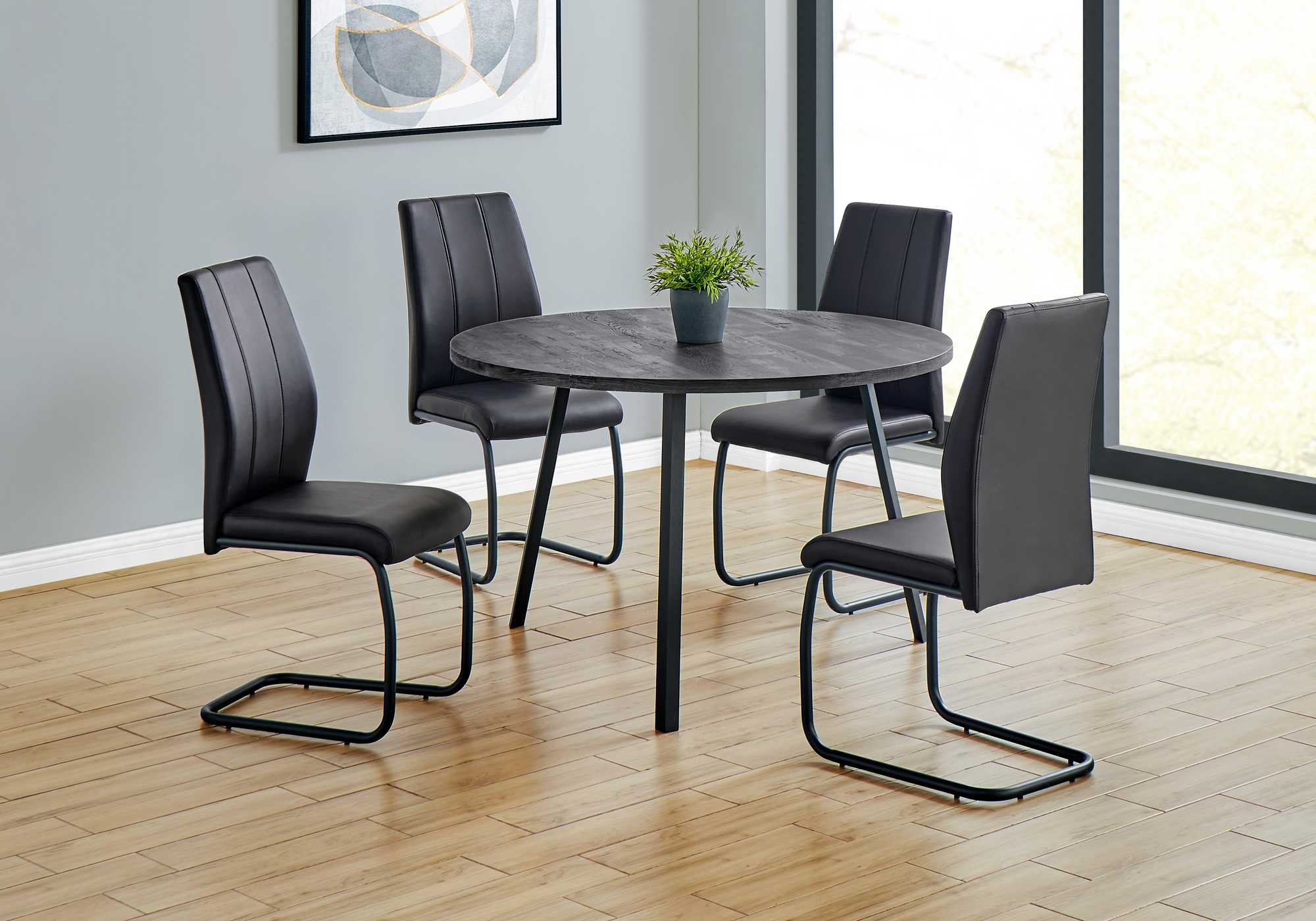 48-inch round dining room table with black reclaimed wood top and black metal legs, perfect for modern dining spaces.