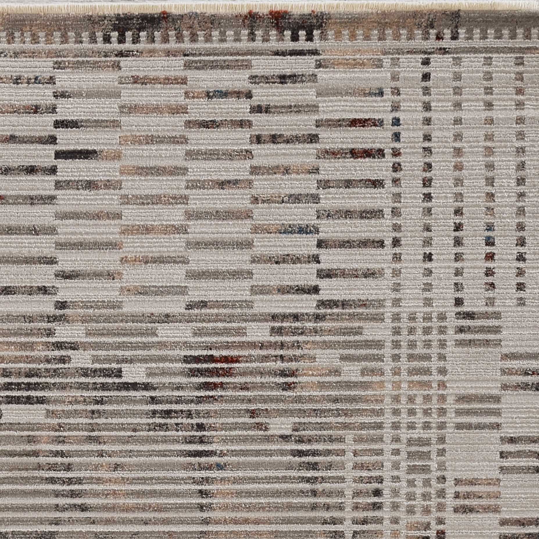 Beige machine woven rug with abstract lines design, showcasing texture and metallic highlights, perfect for contemporary living spaces.