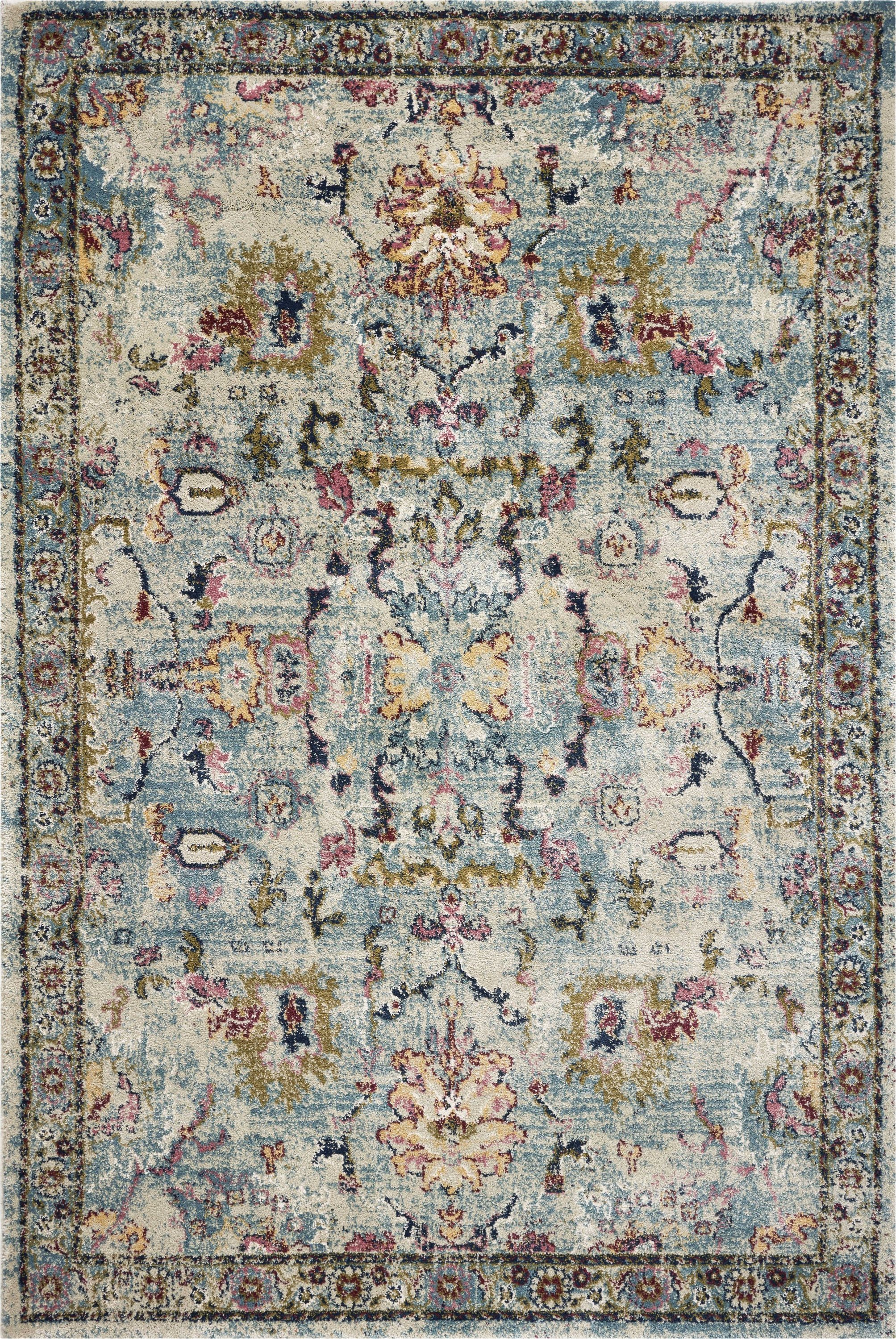 5' x 7' light blue polypropylene area rug with a contemporary design, perfect for enhancing home decor.