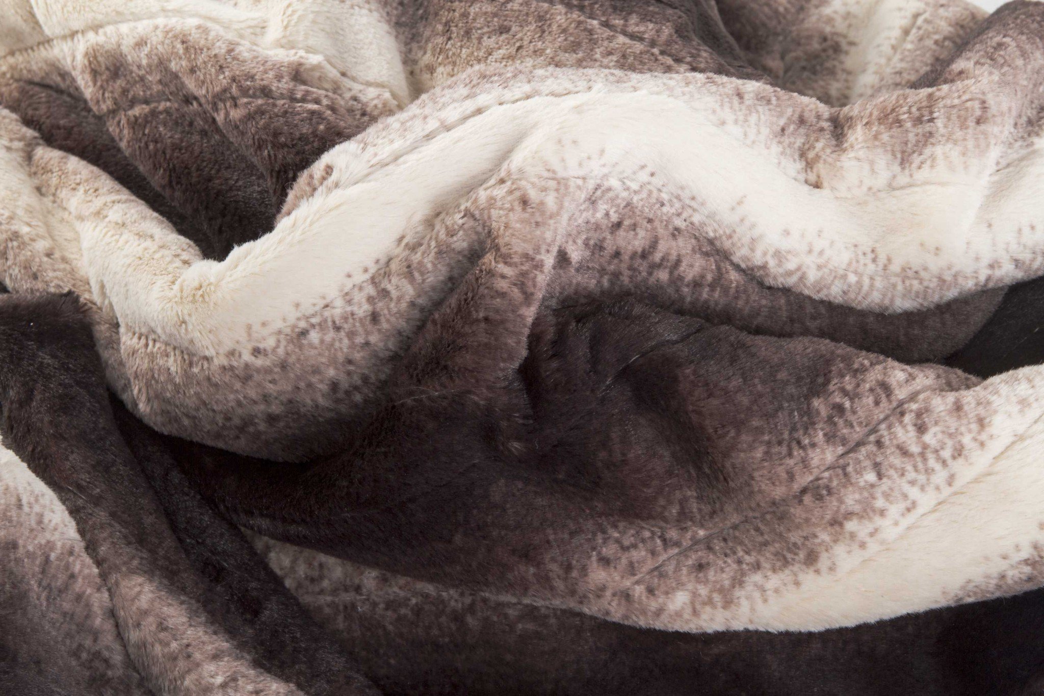 A luxurious 50x60 inches heated throw blanket in brown and white faux fur, showcasing its plush texture and modern contemporary design.