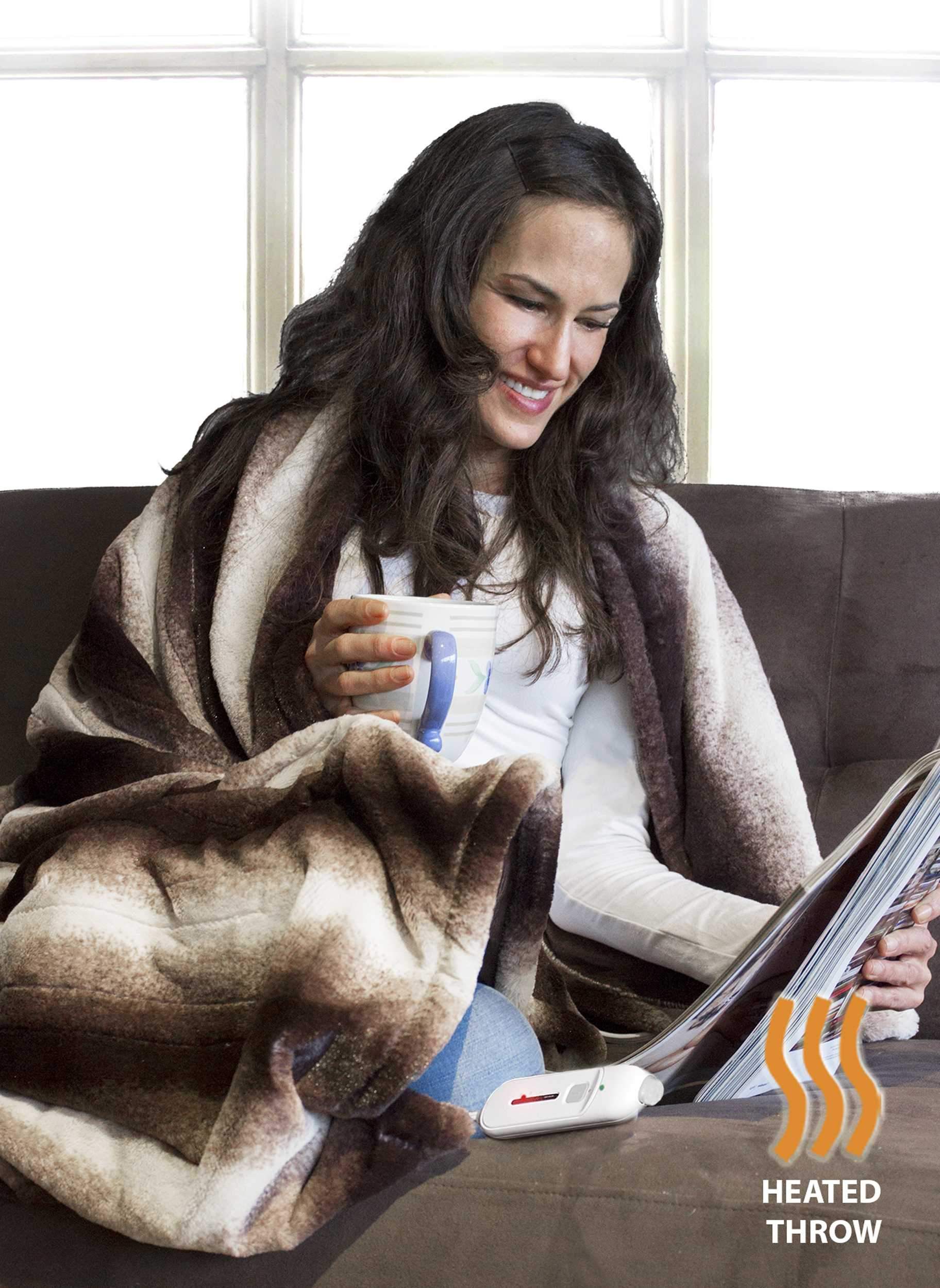 A luxurious 50x60 inches heated throw blanket in brown and white faux fur, showcasing its plush texture and modern contemporary design.