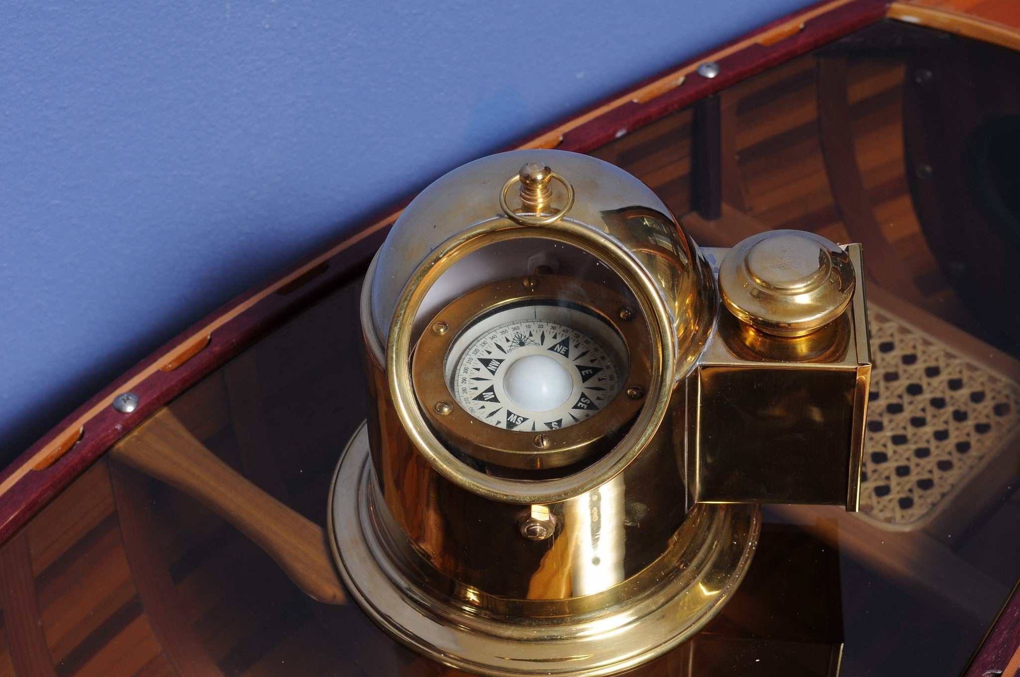 A beautifully crafted 5.25x6x6 inches Binnacle Compass made of solid brass with a golden glow, featuring a floating dial and an oil lamp.