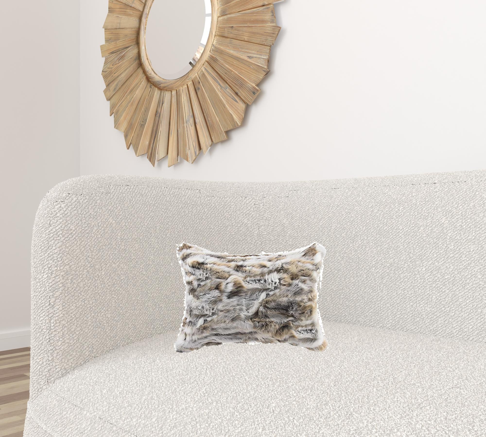 Luxurious 5x12x20 inches tan and white rabbit fur pillow, showcasing its soft texture and elegant design.
