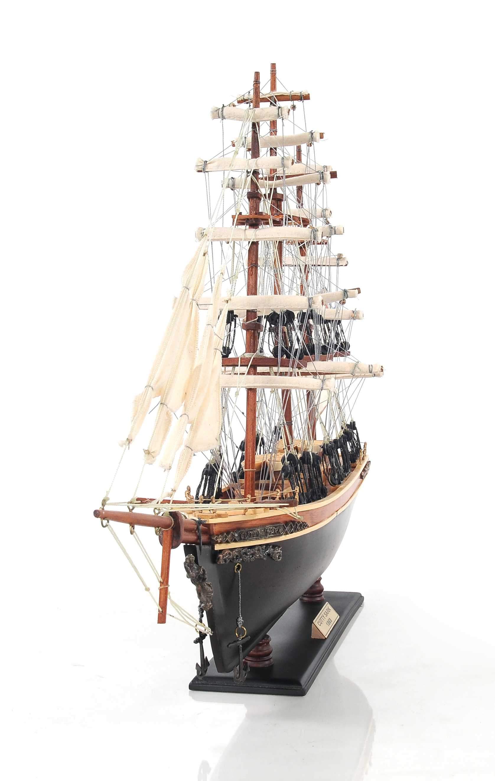 Handcrafted Small Cutty Sark model made of exotic wood with detailed features including masts, sails, and metal ornaments.