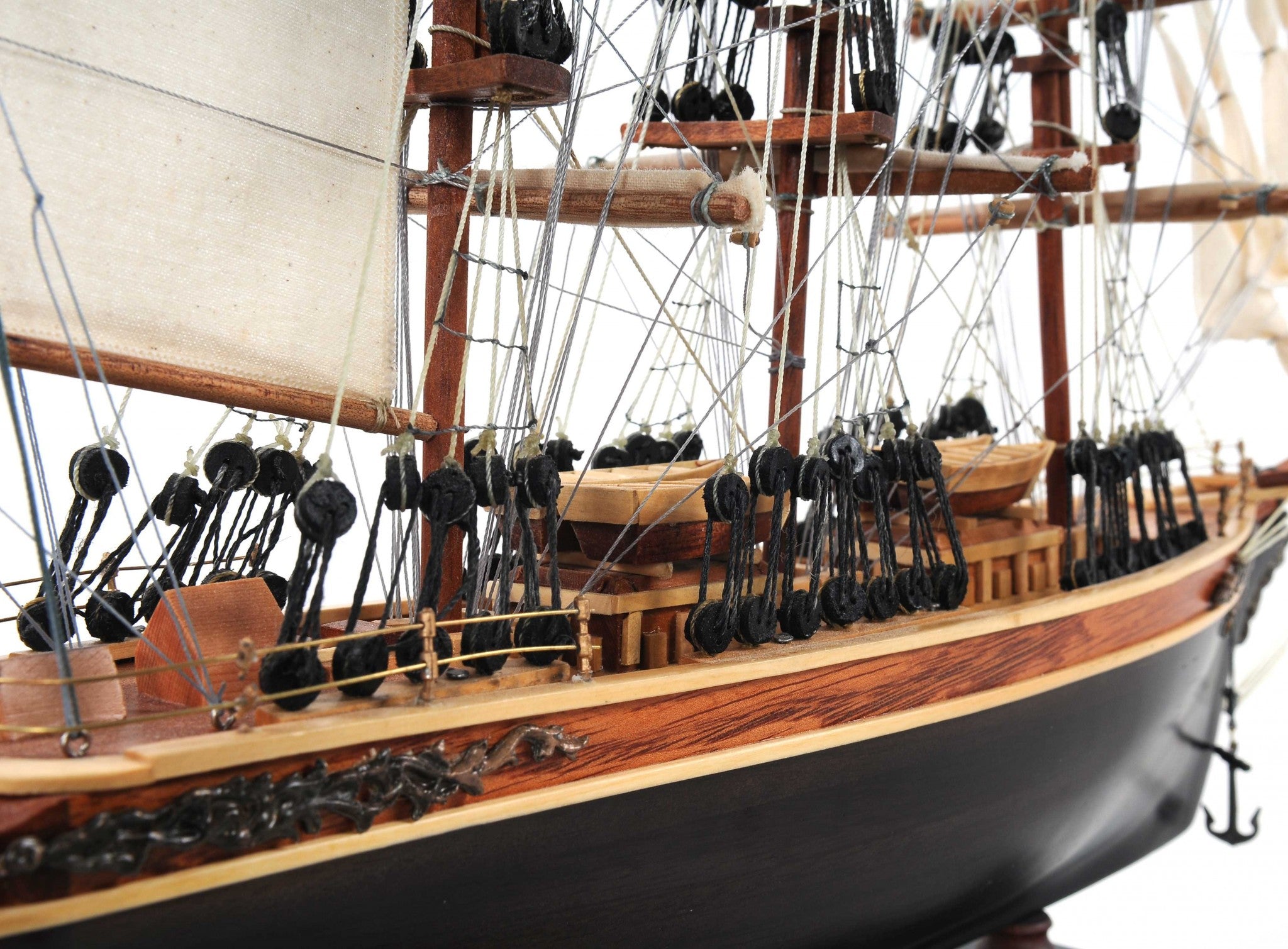 Handcrafted Small Cutty Sark model made of exotic wood with detailed features including masts, sails, and metal ornaments.