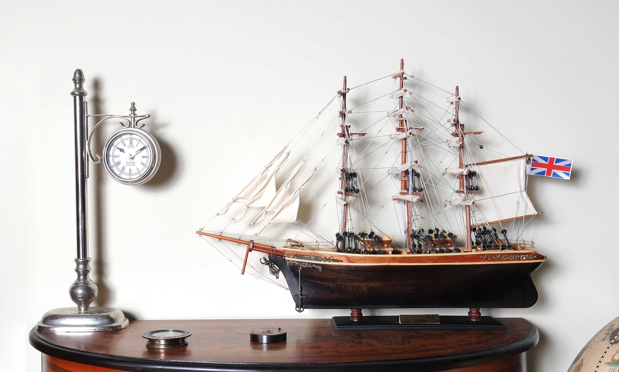 Handcrafted Small Cutty Sark model made of exotic wood with detailed features including masts, sails, and metal ornaments.