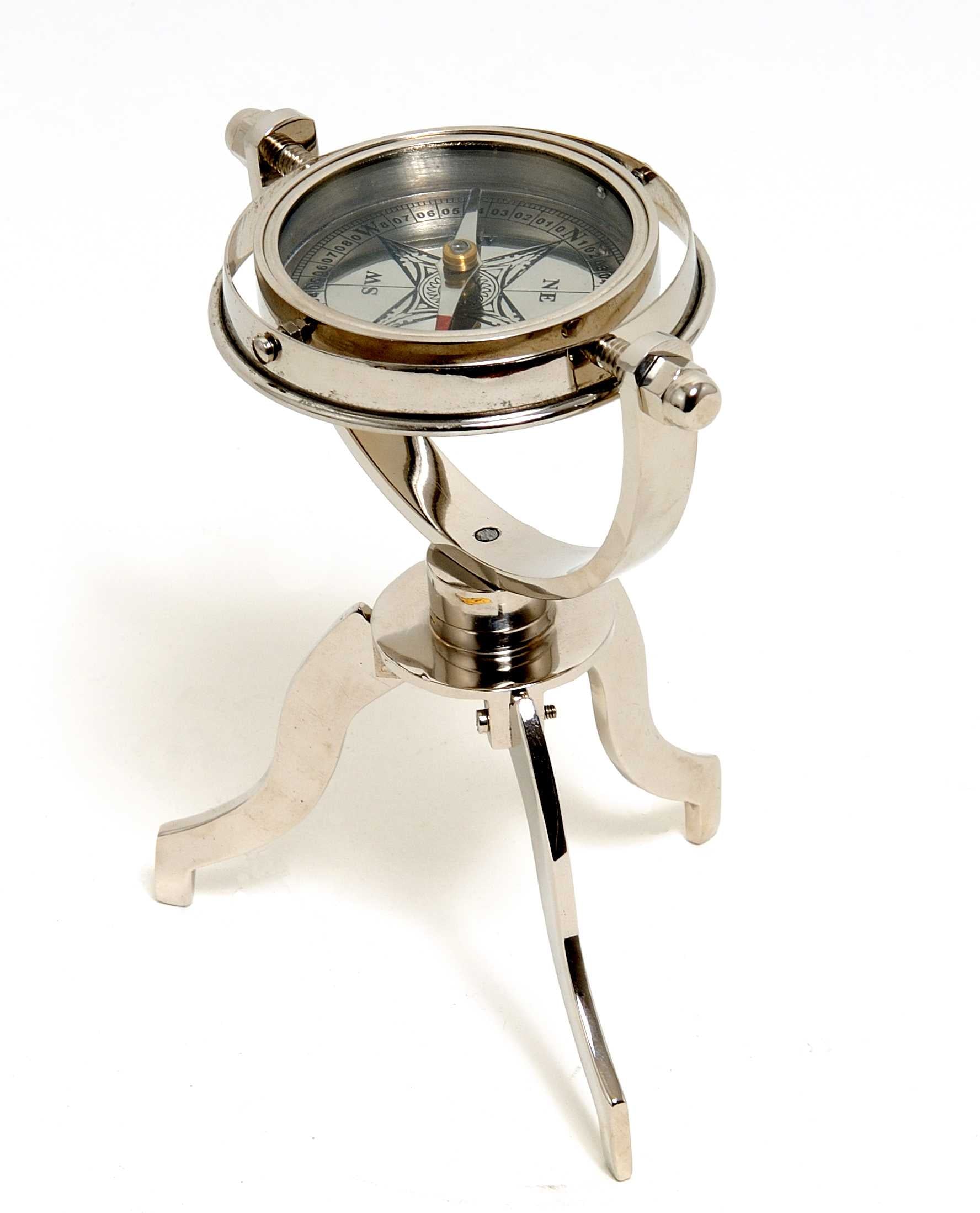 5 inches x 5 inches x 8.5 inches gimbaled compass on a solid brass tri-stand, showcasing a silver tinted finish and intricate craftsmanship.