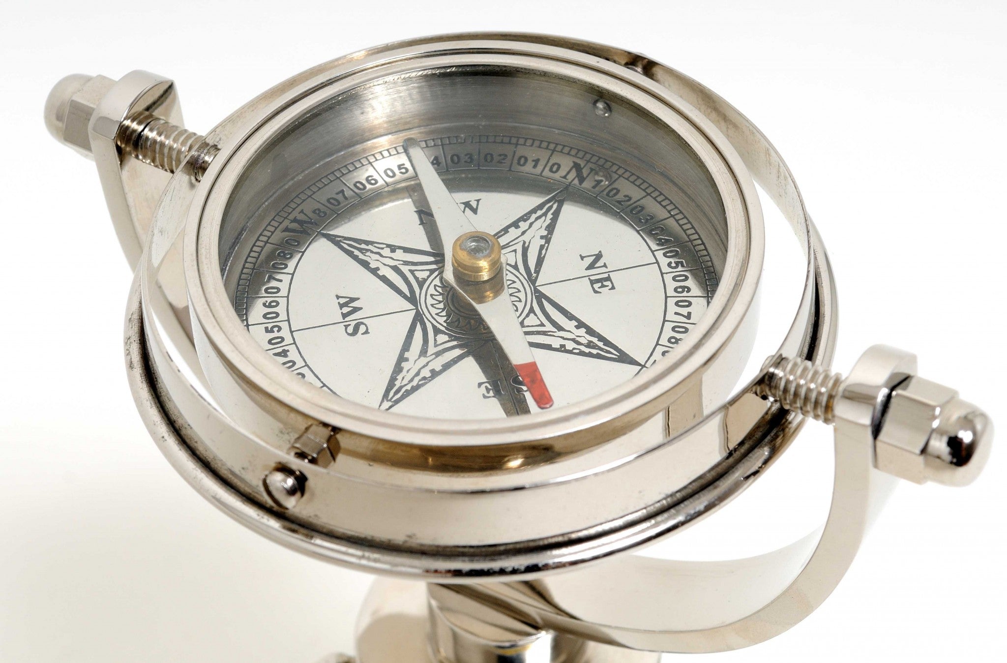 5 inches x 5 inches x 8.5 inches gimbaled compass on a solid brass tri-stand, showcasing a silver tinted finish and intricate craftsmanship.