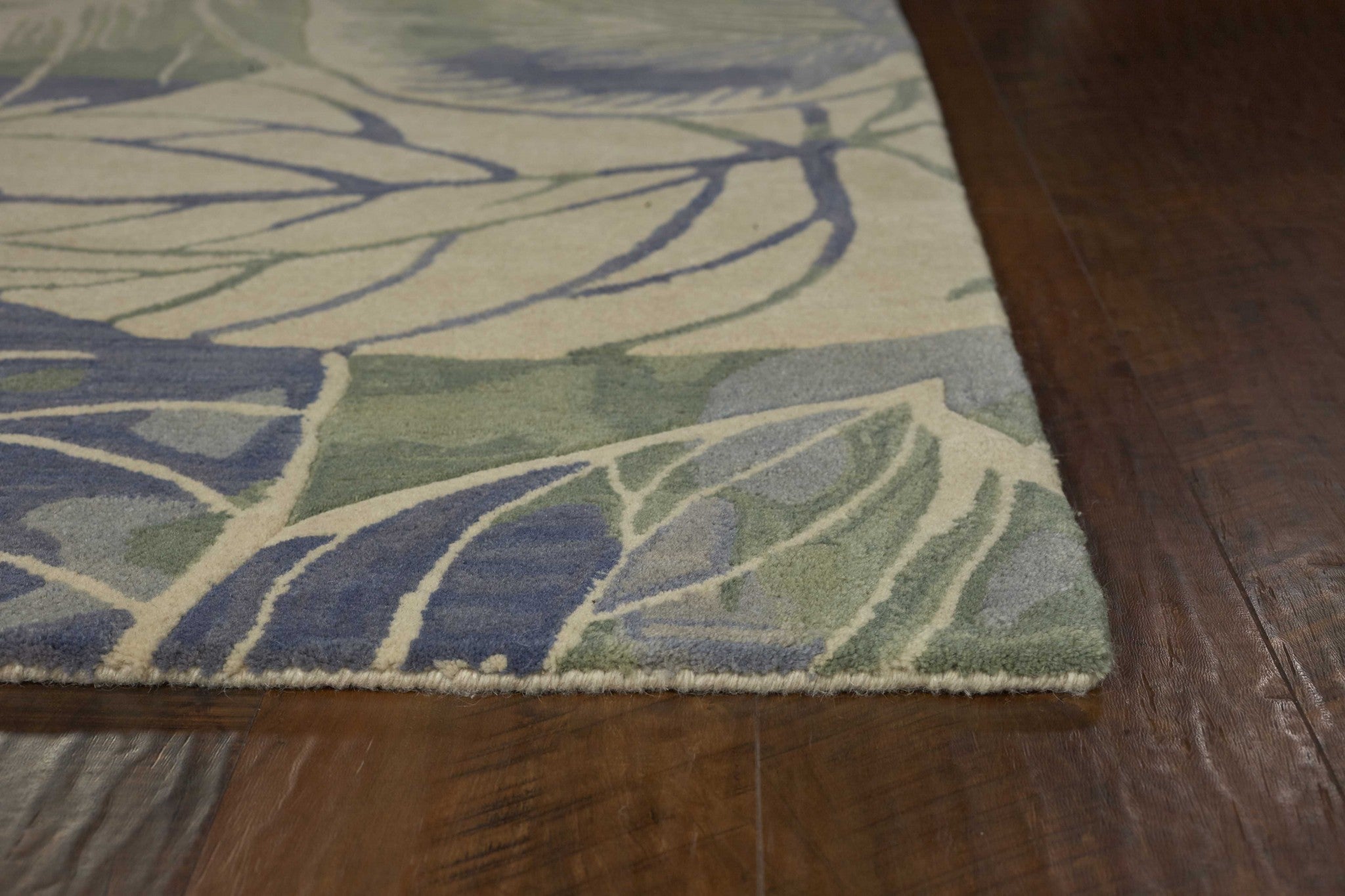 5 inches x 8 inches blue green hand tufted caladium indoor area rug with floral design, showcasing vibrant colors and soft texture.