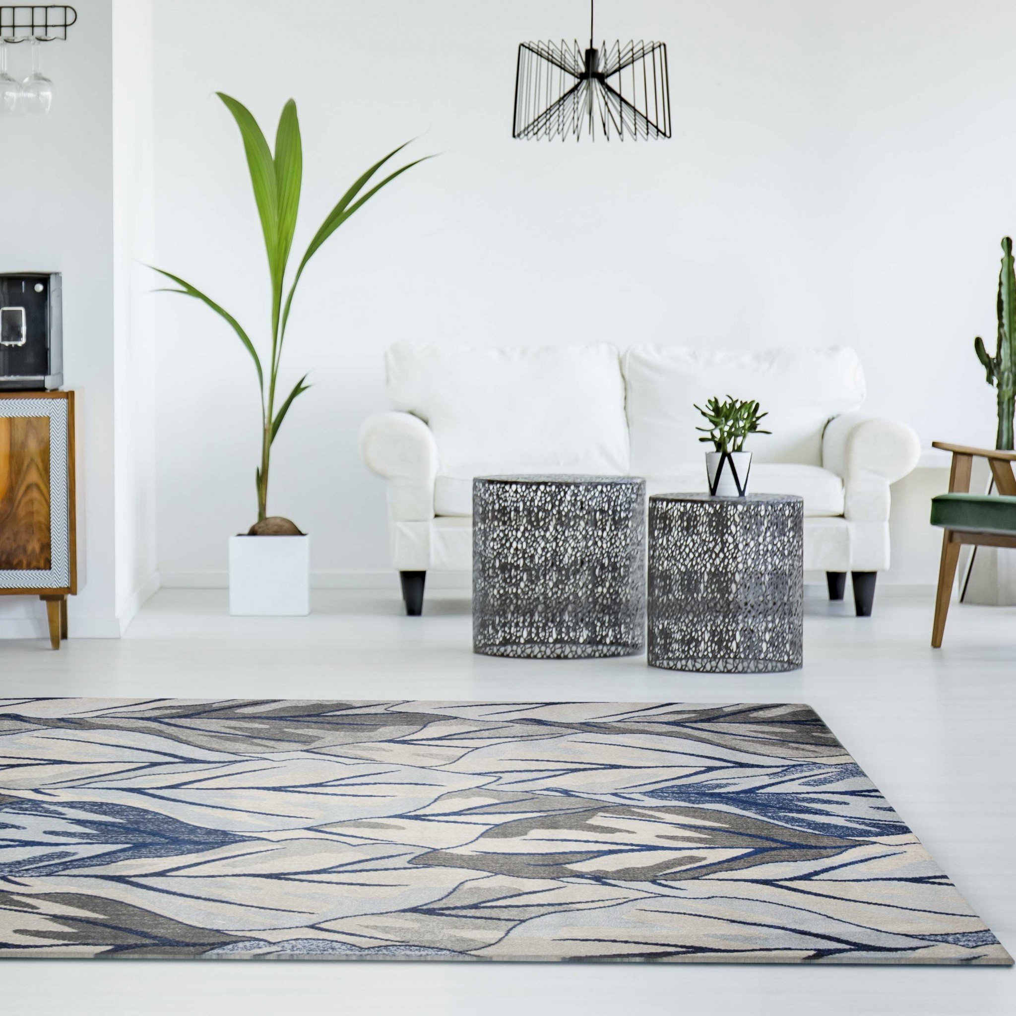5x8 Grey Navy Machine Woven Tropical Indoor Area Rug showcasing a modern design with a sophisticated color palette.