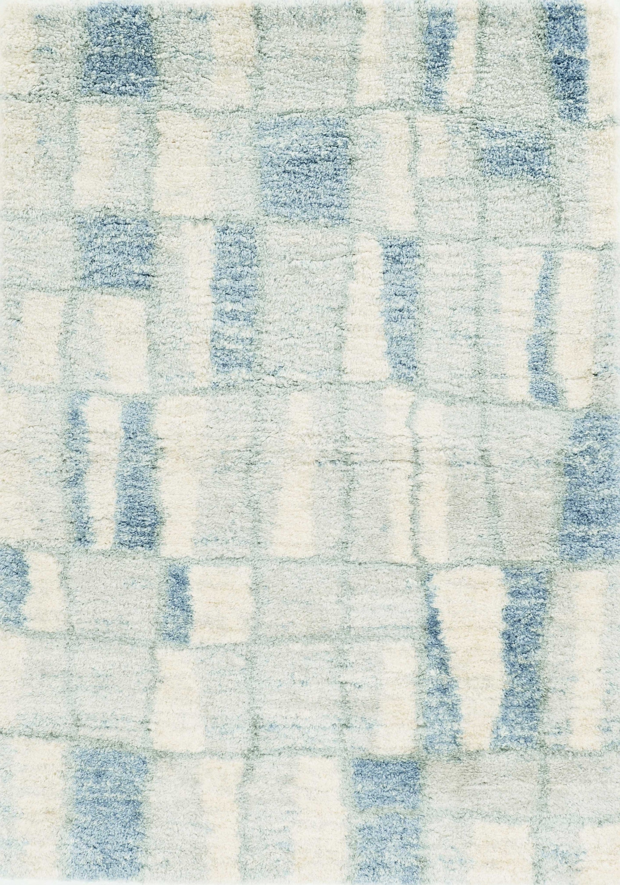 5x8 ivory blue machine woven abstract blocks indoor area rug showcasing modern design and soft textures.