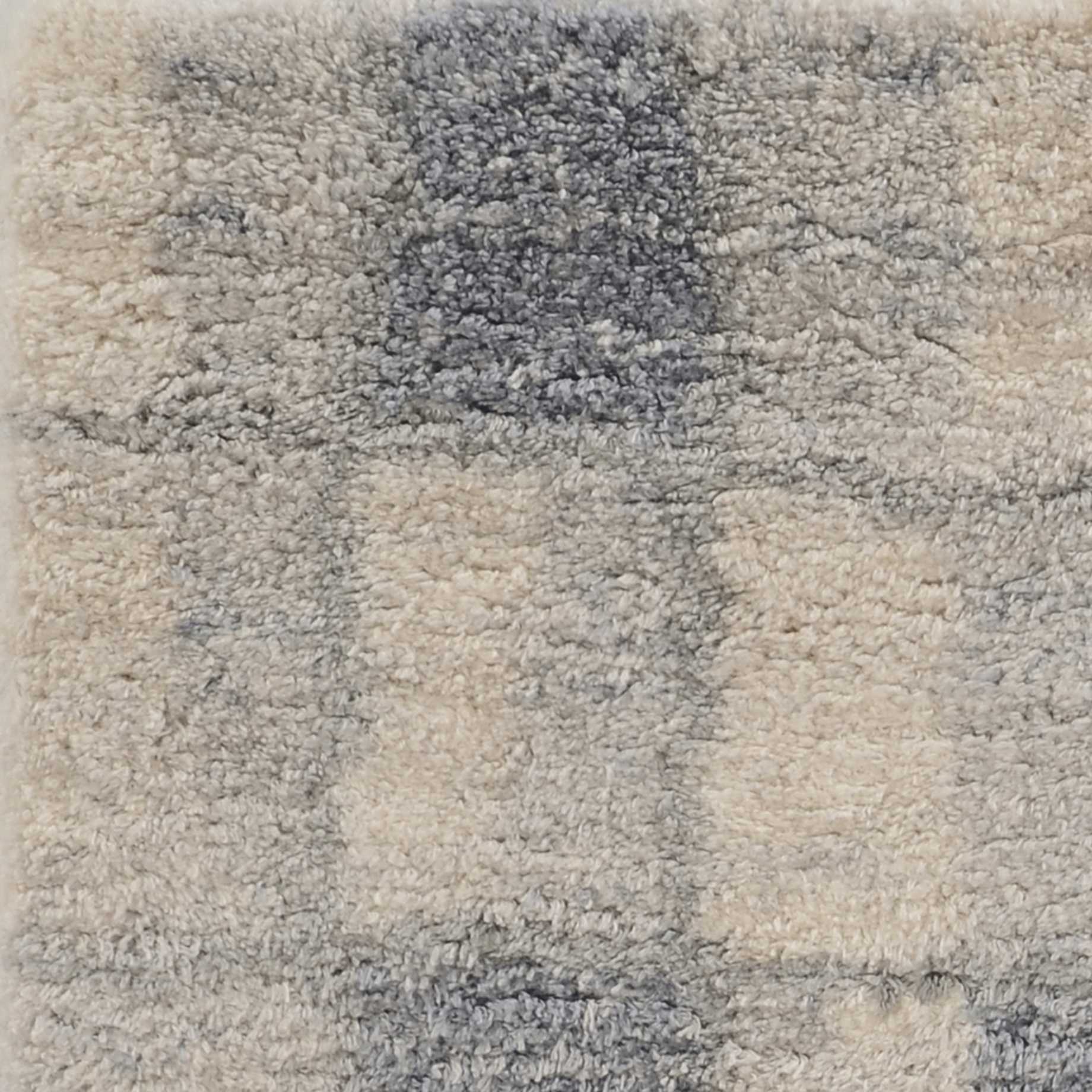 5x8 ivory blue machine woven abstract blocks indoor area rug showcasing modern design and soft textures.