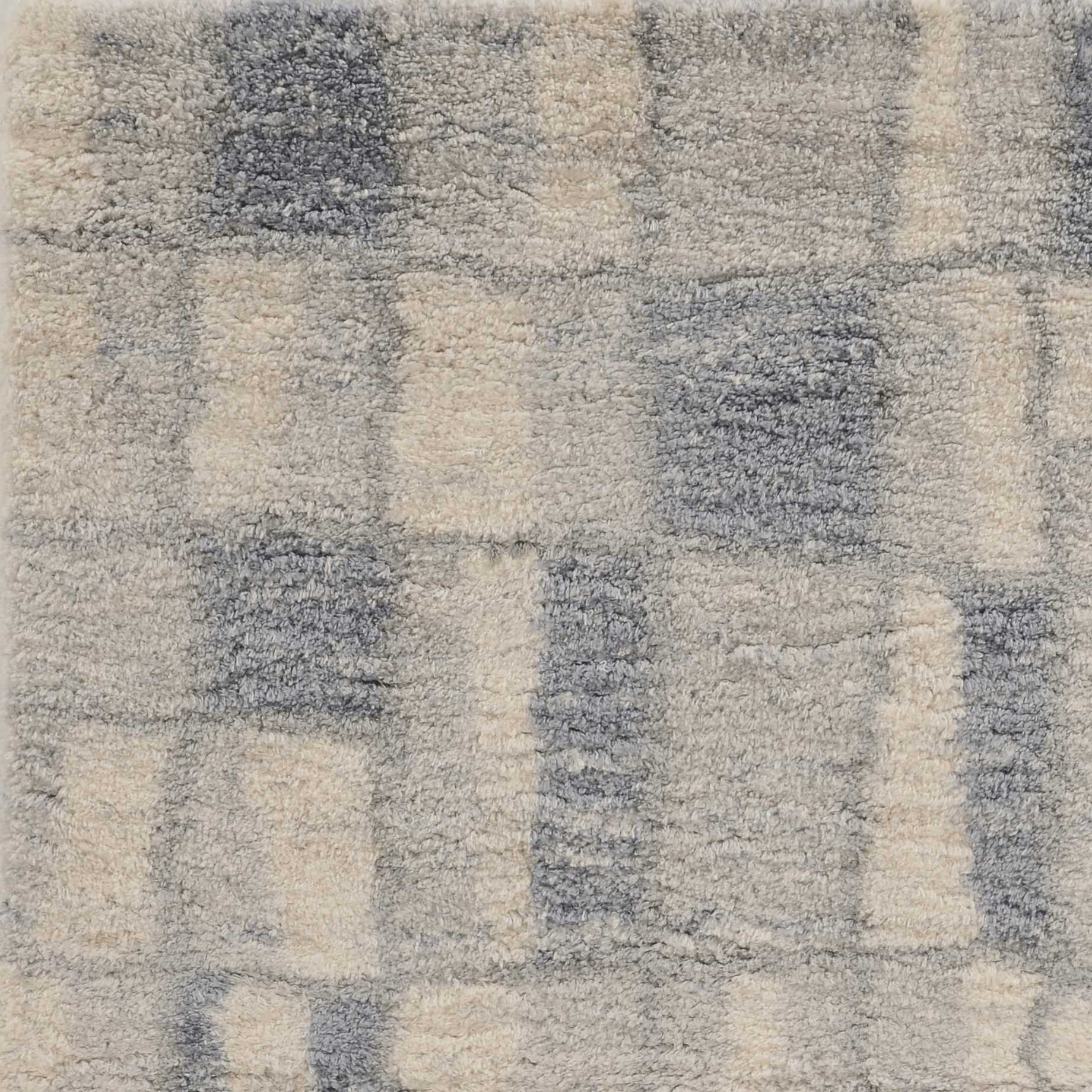 5x8 ivory blue machine woven abstract blocks indoor area rug showcasing modern design and soft textures.