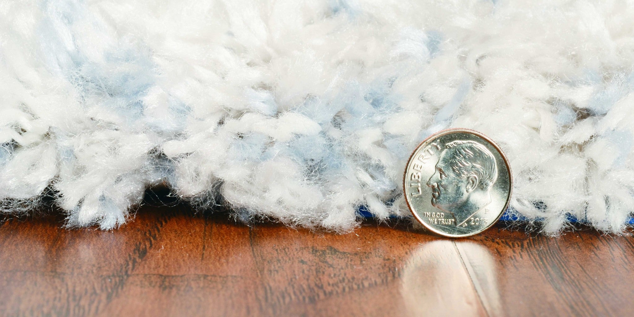 5x8 ivory blue machine woven abstract blocks indoor area rug showcasing modern design and soft textures.