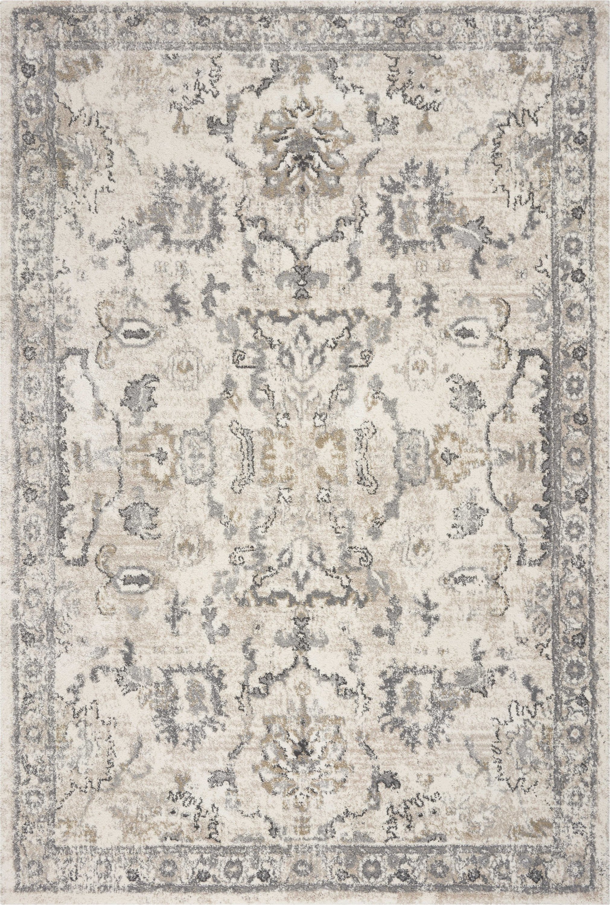 5x8 inches ivory machine woven distressed floral rug showcasing intricate floral patterns and a contemporary design.