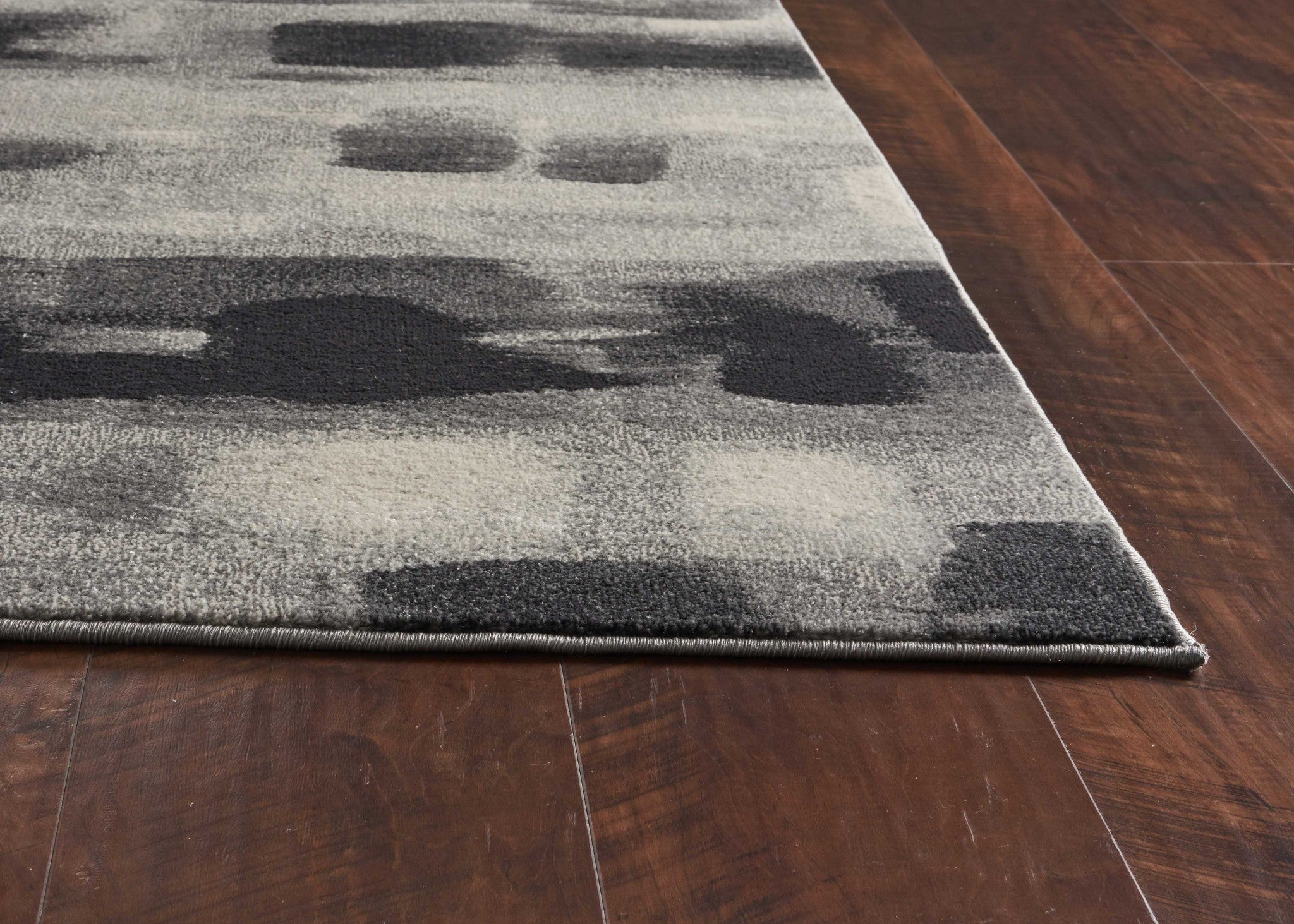 5x8 Shades of Grey Machine Woven Abstract Brushstroke rug showcasing a modern abstract design in grey tones, perfect for enhancing home decor.