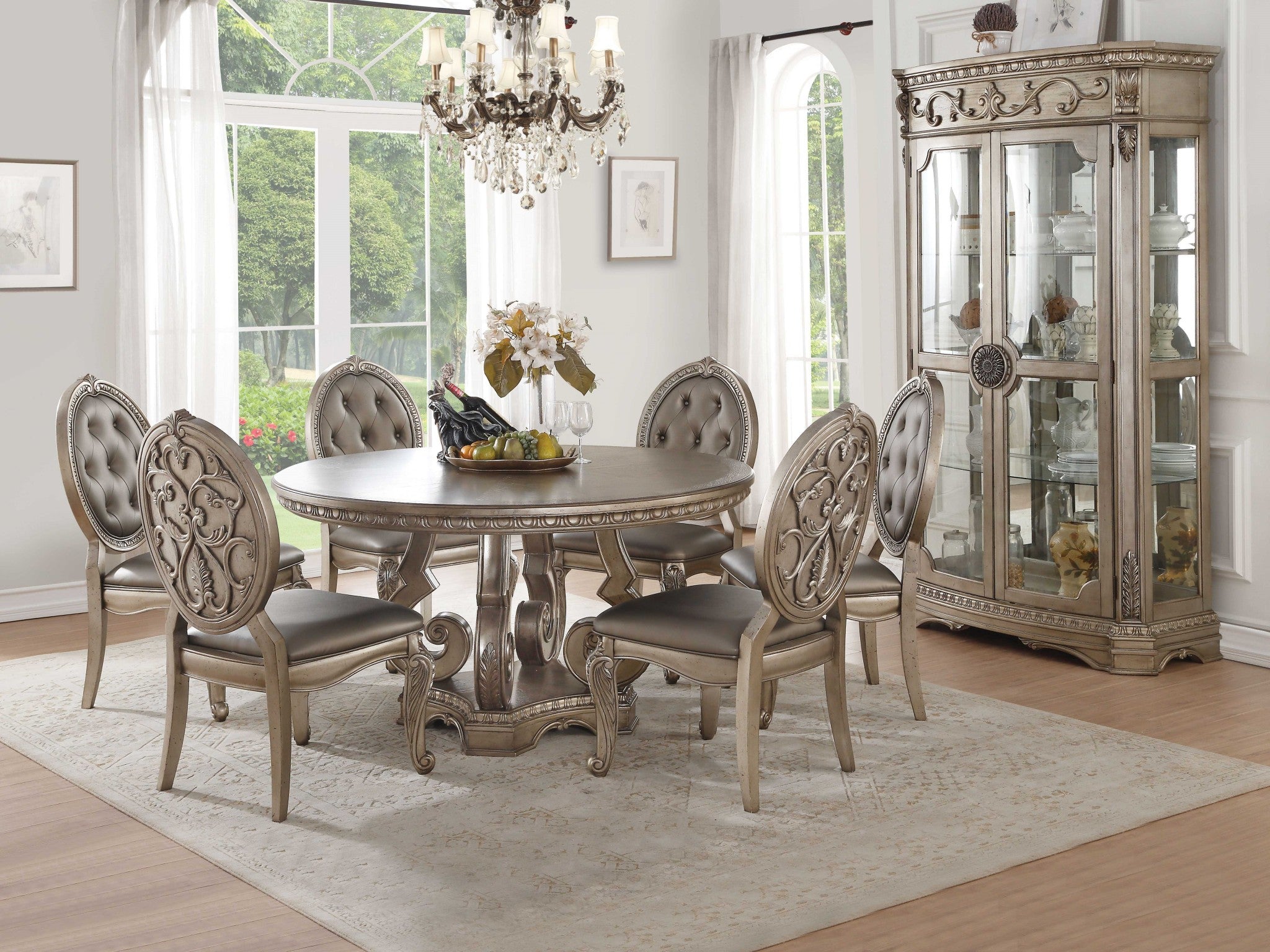 A beautifully crafted 60x60 inches Antique Champagne Dining Table featuring raised motifs and carved molding trim, supported by four scrolled legs.