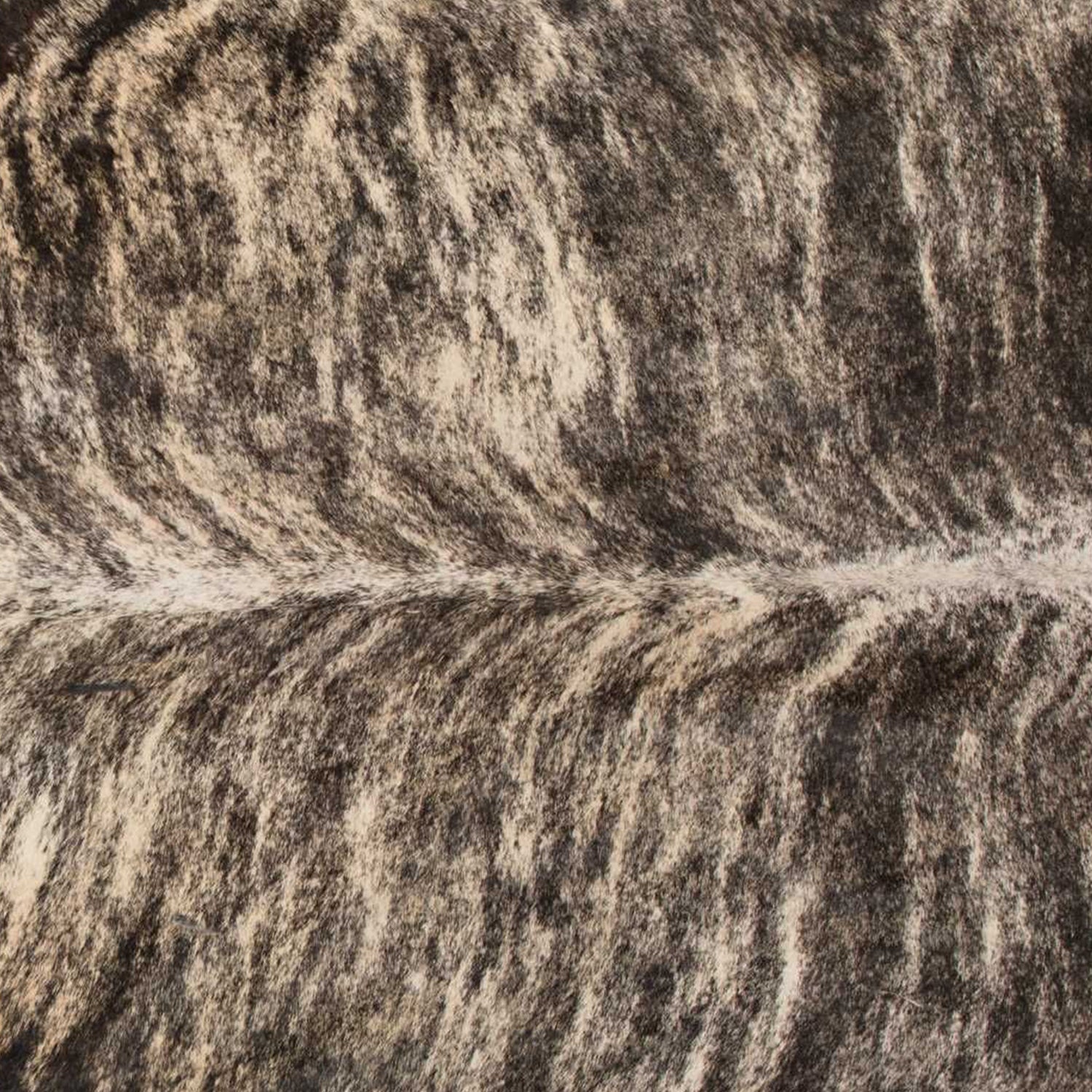 Handmade black and white cowhide area rug measuring 60x84 inches, showcasing a luxurious texture and unique patterns.