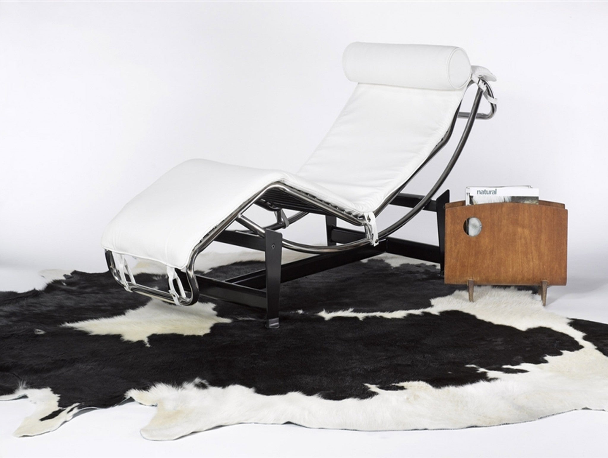 Handmade black and white cowhide area rug measuring 60x84 inches, showcasing a luxurious texture and unique patterns.